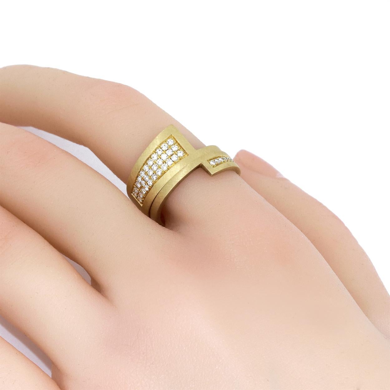 Nordic Stacking Rings hand-fabricated in Denmark by jewellery maker Annette Wille in signature finished 18k yellow gold, featuring two spectacular rings from her renowned Nordic collection. The first band is 9.5mm in width and set with thirty round
