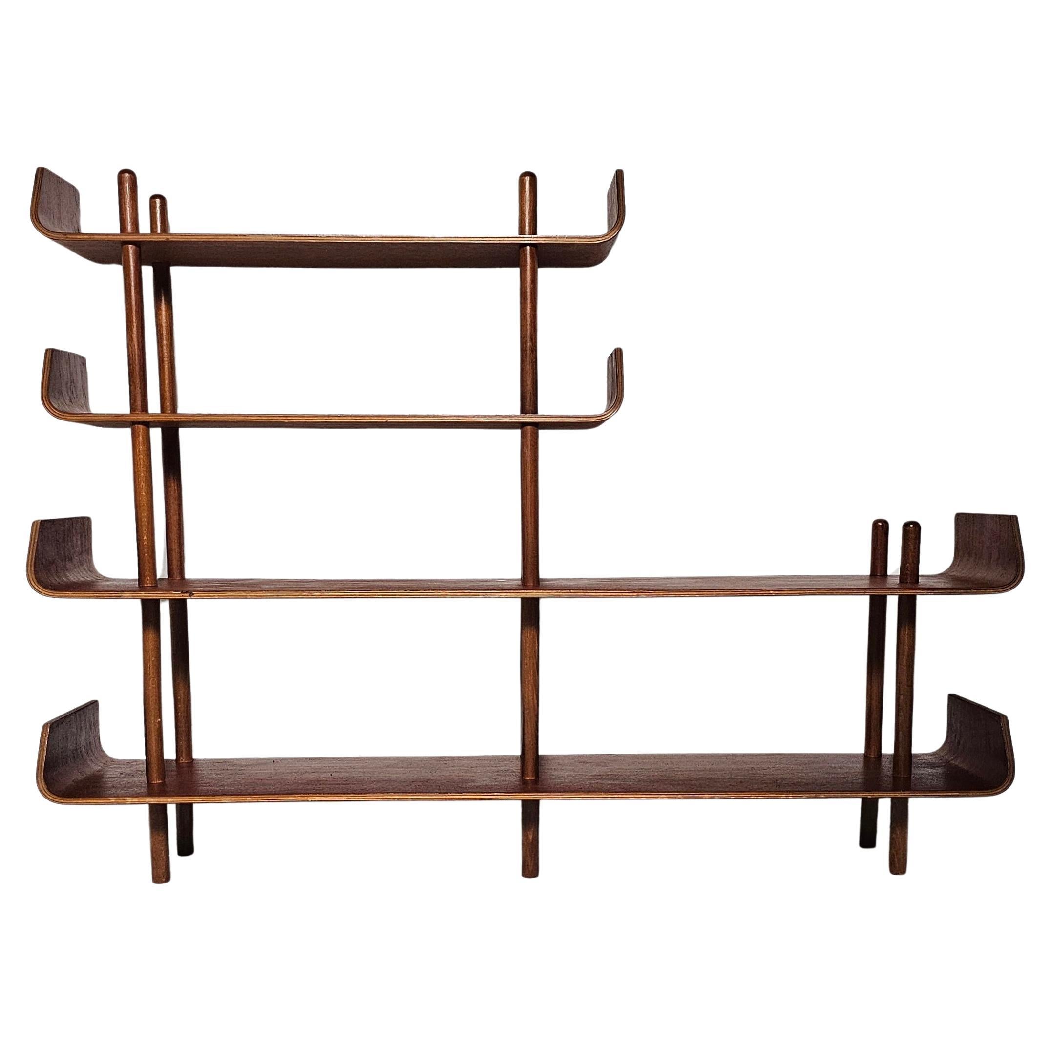 A refined example of Dutch mid-century modern design, this modular bookcase was designed by Willem Lutjens and manufactured by Gouda Den Boer in the 1950s.

Lutjens is renowned for his elegant use of bent plywood and his dedication to functional