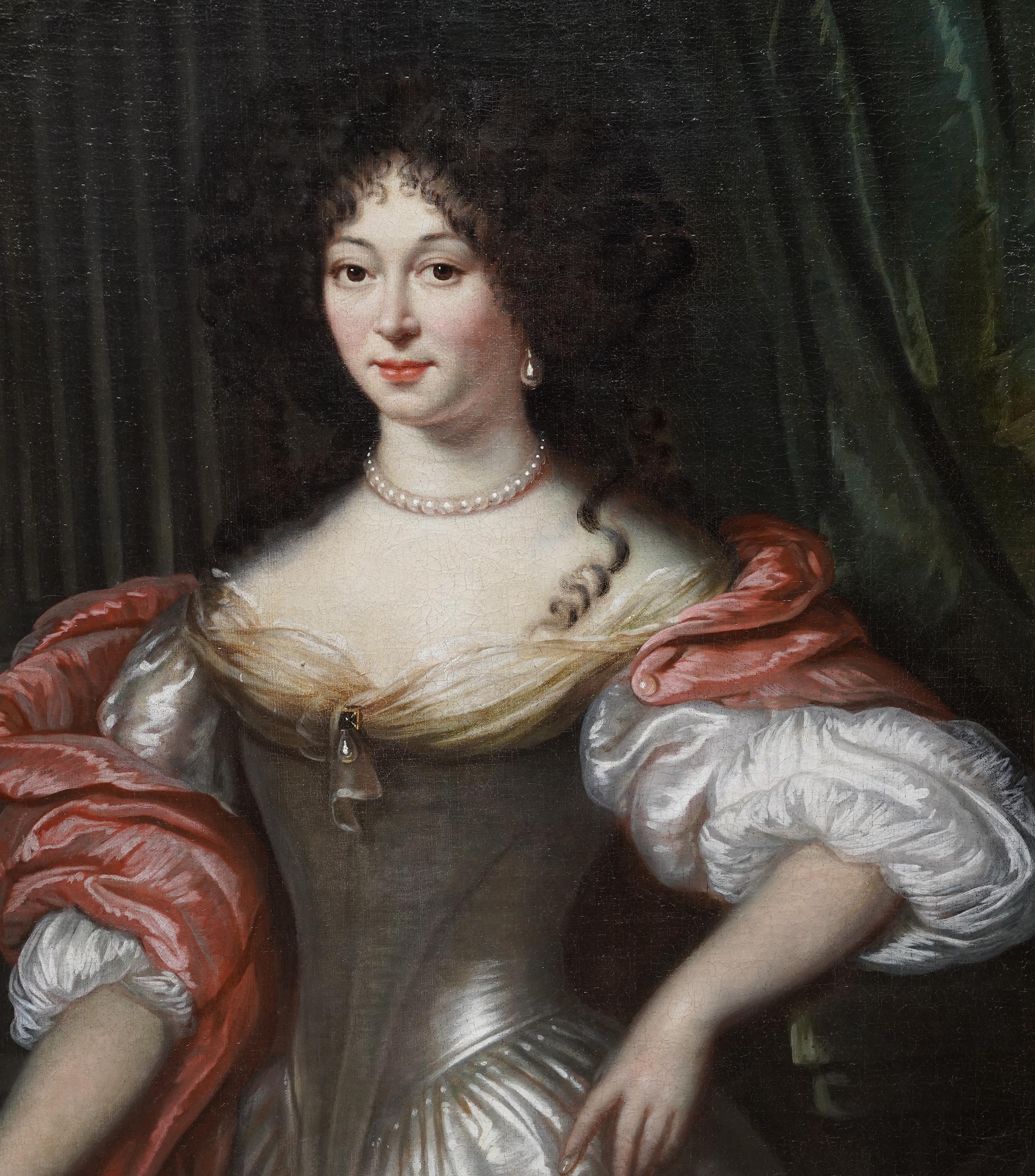 Ce charmant portrait hollandais à l'huile est attribué au cercle de Willem Wissing. Wissing s'est installé en Angleterre et s'est imposé comme l'élève le plus important de Peters après sa mort. Peinte vers 1680, la composition est un portrait debout