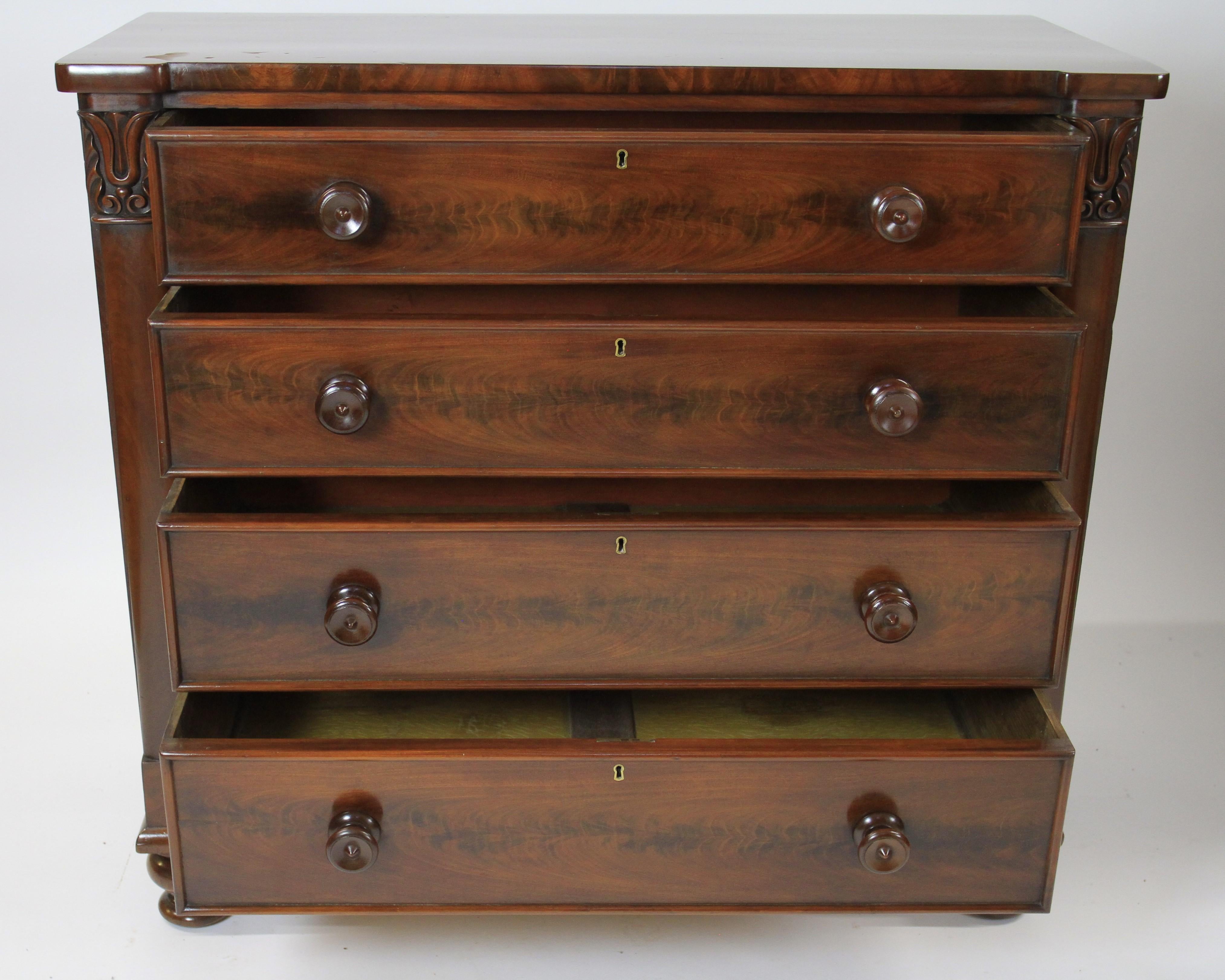 Fine W1V Period  Mahogany 4 drawer chest 
Quality Figured Mahogany veneer on top & Drawer fronts, 
Original locks, turned mahogany drawer knobs, 
Pair Pilasters with carved Tulip detail,
Shaped Frieze
Sitting On 4 Turned Mahaoany Feet
Drawers with