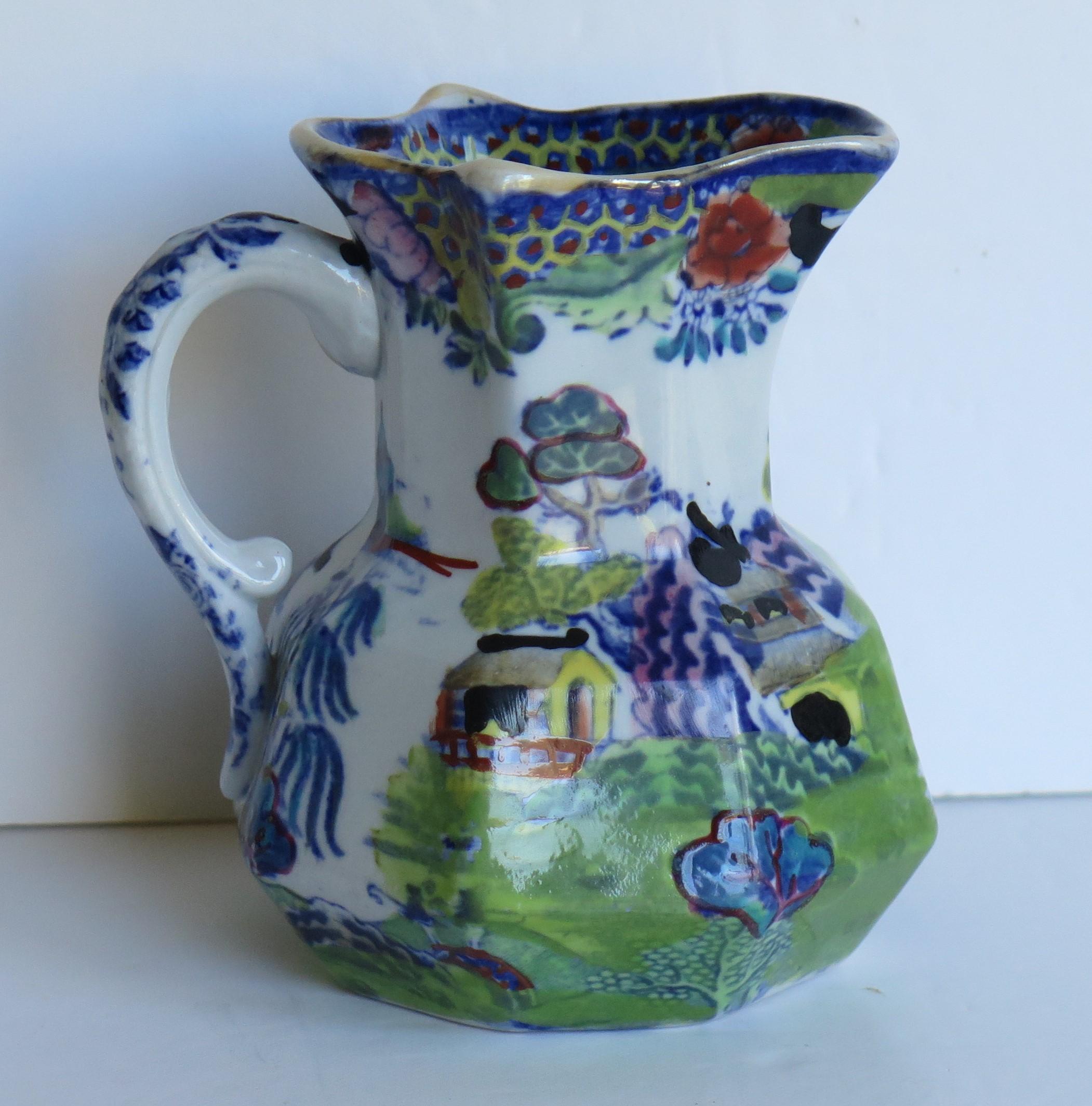This is a good, Mason's Ironstone Hydra jug or pitcher in the Turner Willow, colored Blue and White pattern, made in the English,  first half of the 19th C period, circa 1830.

The jug has an octagonal shape with a notched snake handle and is
