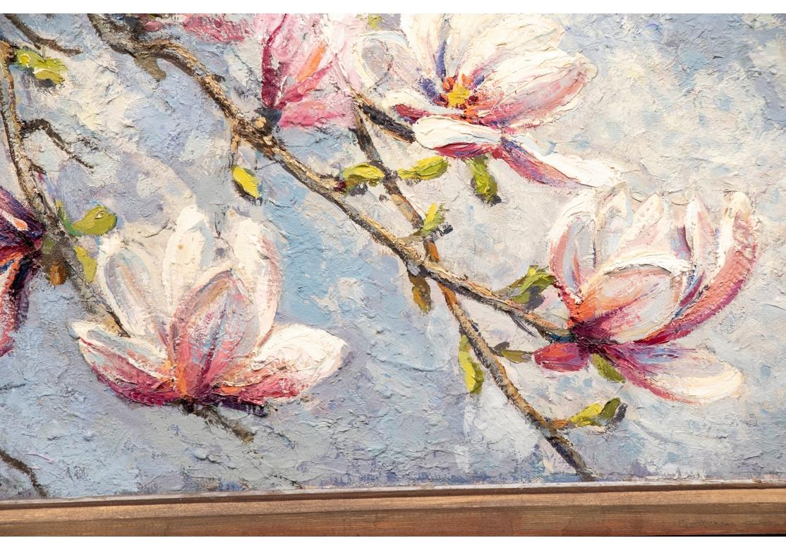 Unsigned, from the estate of the artist. A large painting of a magnolia tree blooming in the spring with its gorgeous pink and white cupped flowers. The branches fall against a blue and white sky. It is painted in a fine textured palette. 
28 x