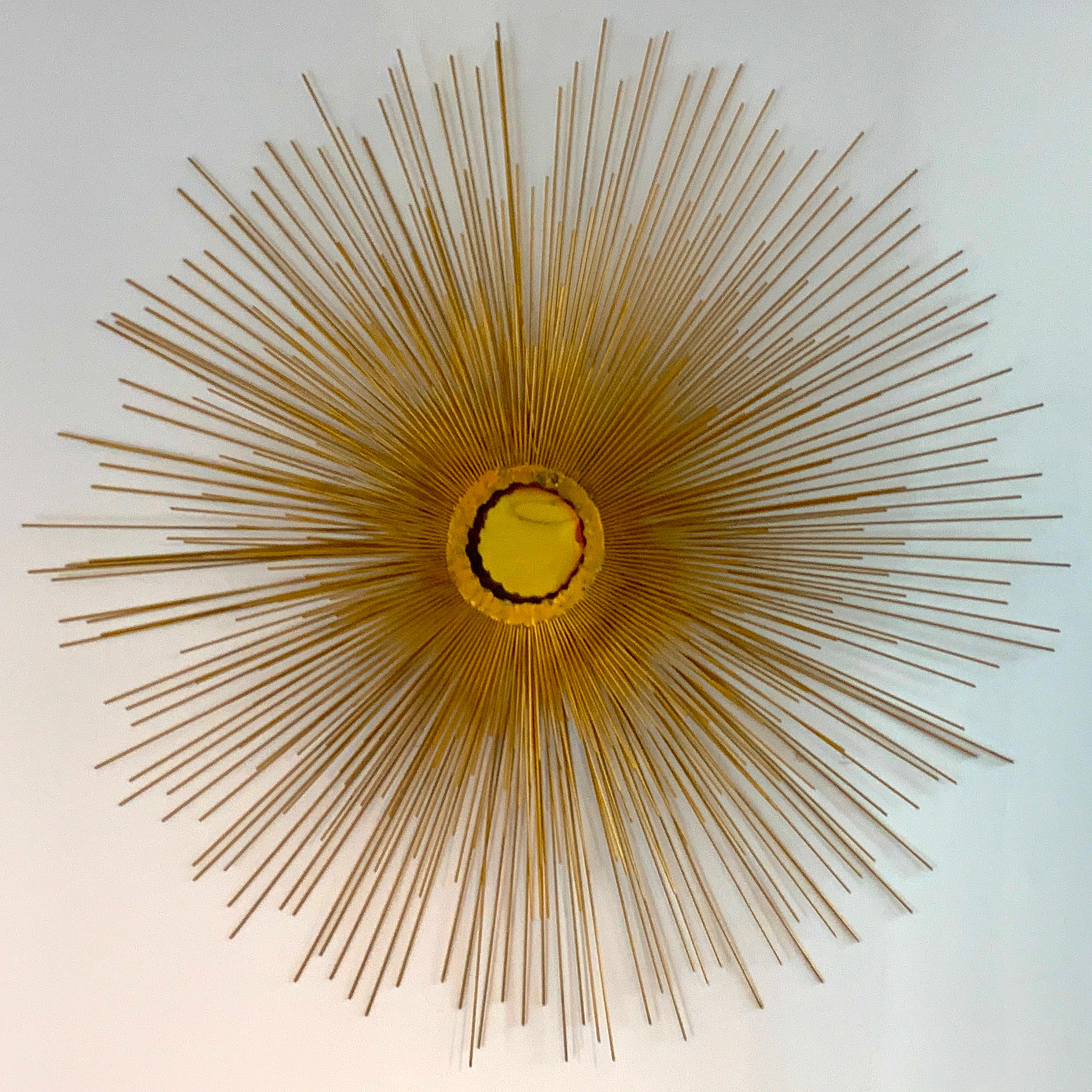 William and Bruce Friedle bronze sunburst wall sculpture, of typical form, a unusual large model 38-inch diameter, with a 5-inch diameter center.