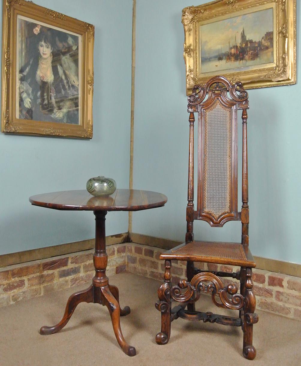 With an excellent colour and very well developed patination, this beautiful walnut chair was made in the late 17th century by a provincial English craftsman. It is of solid walnut and carved with great exuberance, expression and fluidity. The softly