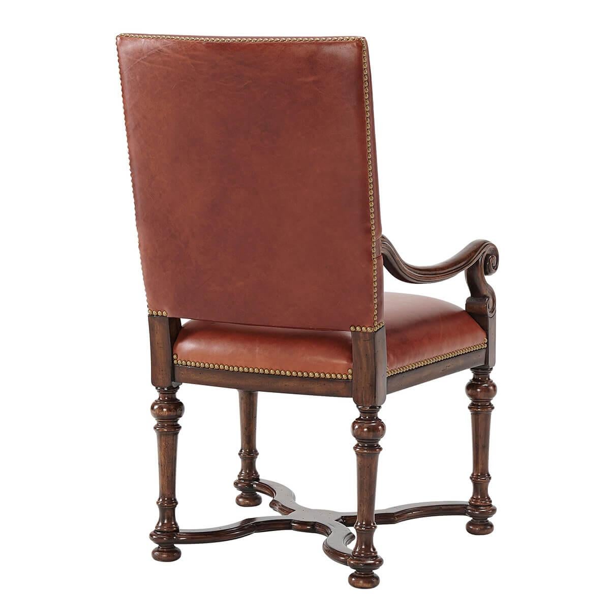 An early English William and Mary style hand carved dining armchair, with a rectangular padded back and an upholstered seat on turned tapering legs joined by a wavy ‘X’ stretcher. 

Dimensions: 24.5