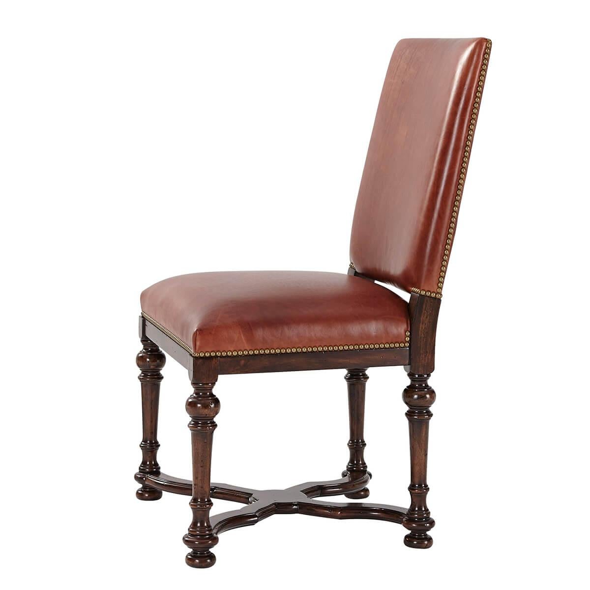 An early English William and Mary style hand-carved side chair, with a rectangular padded back and an upholstered seat on turned tapering legs joined by a wavy ‘X’ stretcher.
Dimensions: 23