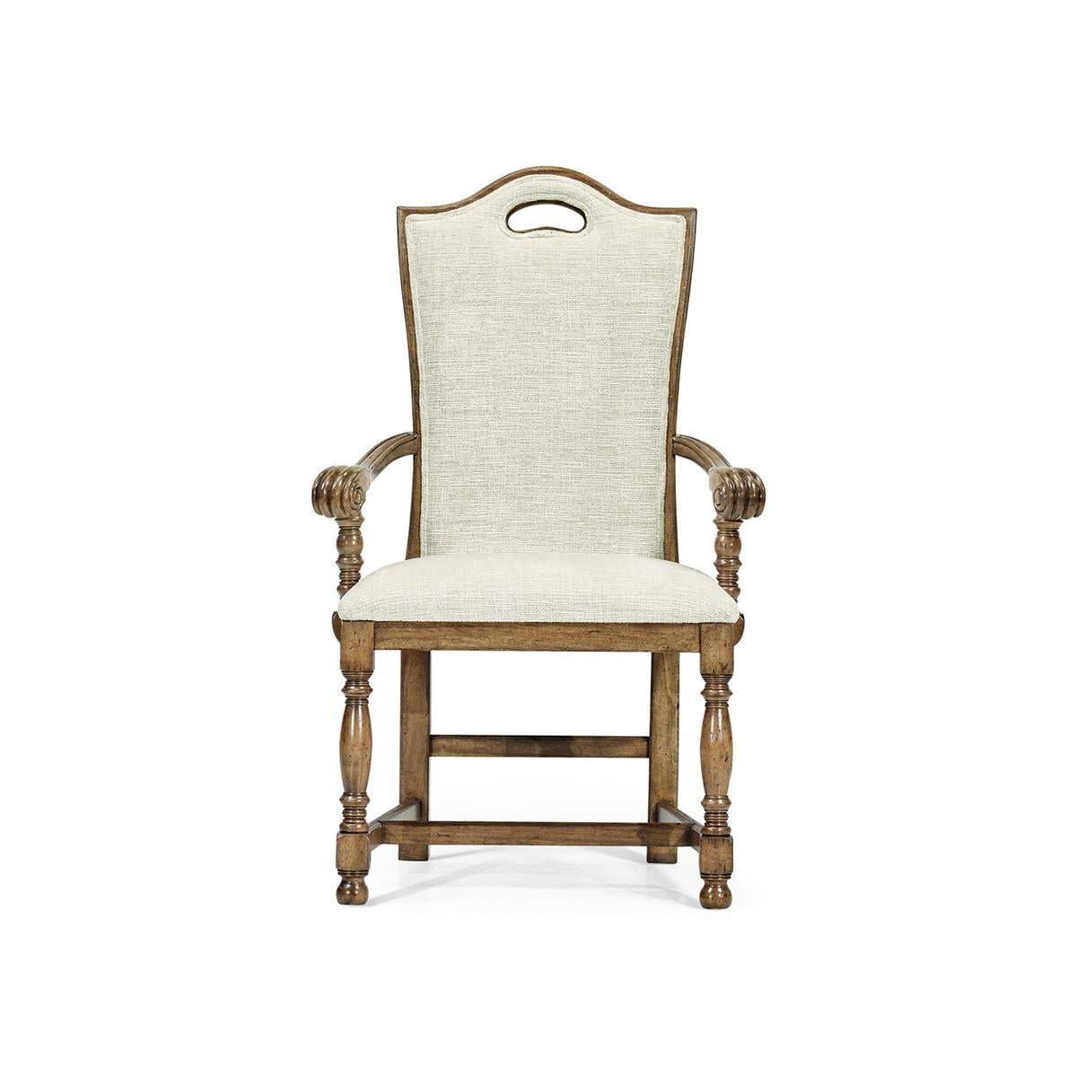 The William and Mary high back armchair is an elegant and comfortable chair with a medium driftwood finish, high backrest, and plush upholstery. It features a beautifully curved top rail with a pierced handle and sturdy construction with baluster