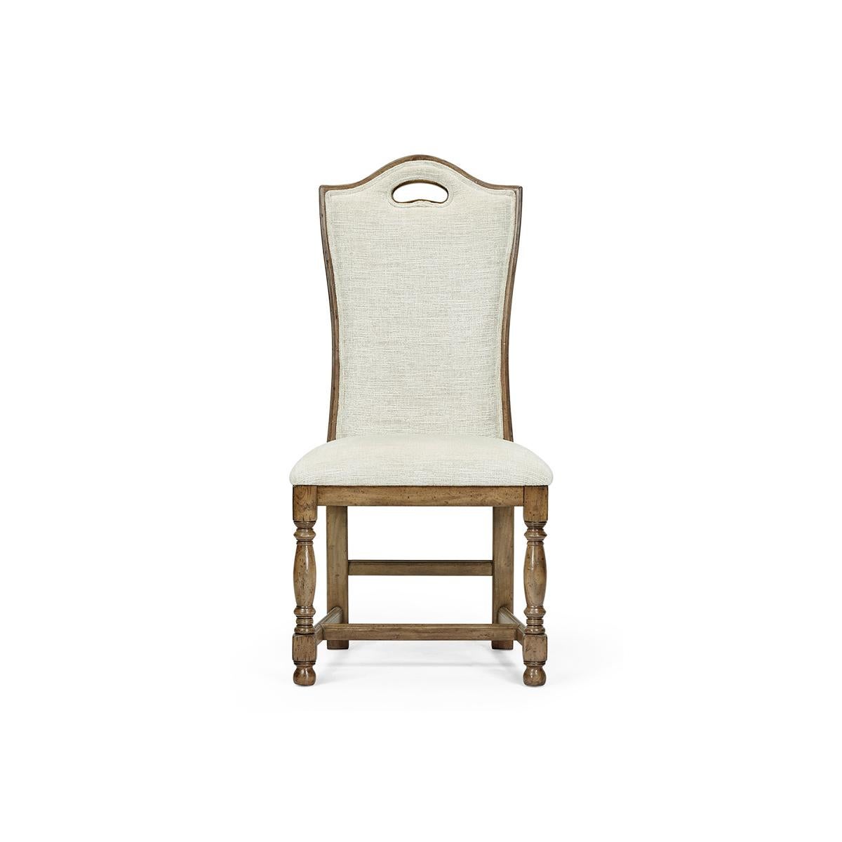 Introducing the magnificent William and Mary high back dining chair - a perfect blend of elegance and comfort. This dining chair is the epitome of sophistication, with its medium driftwood finish, high backrest and plush upholstery. The beautifully