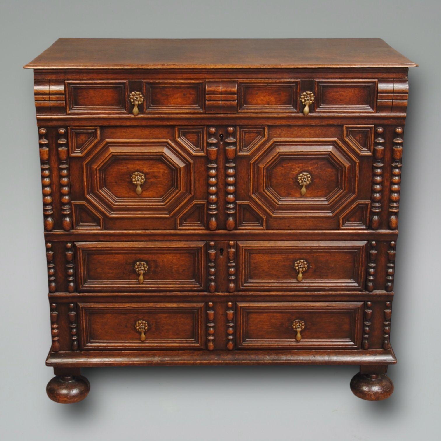 A fine example of a geometric block front chest with bobbin turned decoration, superb colour and patiation.
The two part chest appears to have the original bun feet, the handles are old replacements. Circa 1690