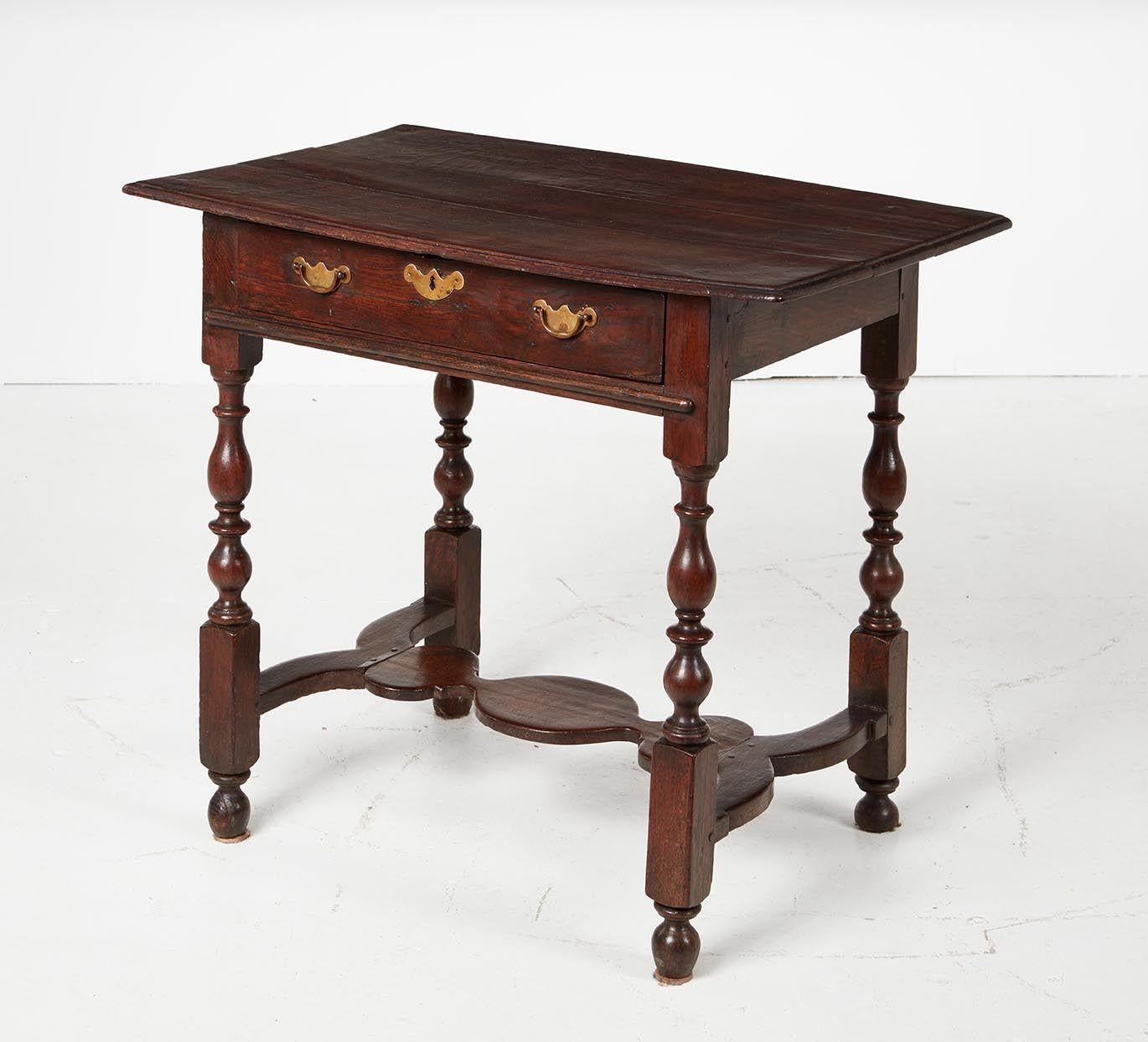 Very good William and Mary period oak single drawer side table with thumb molded top over single drawer, standing on balustrade turned legs joined by characterful flat shaped stretcher and standing on original turned feet, the whole with very good