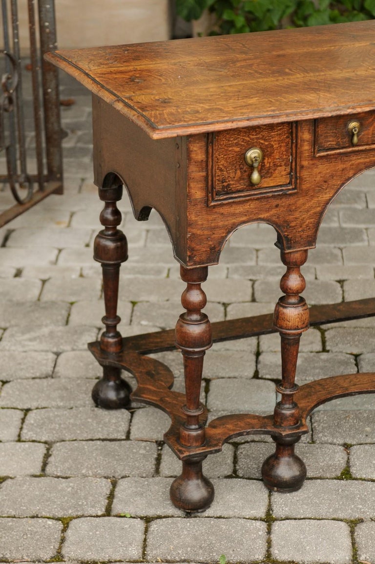 Turned William and Mary Style 1800s Oak Side Table with Trumpet Legs and Three Drawers For Sale