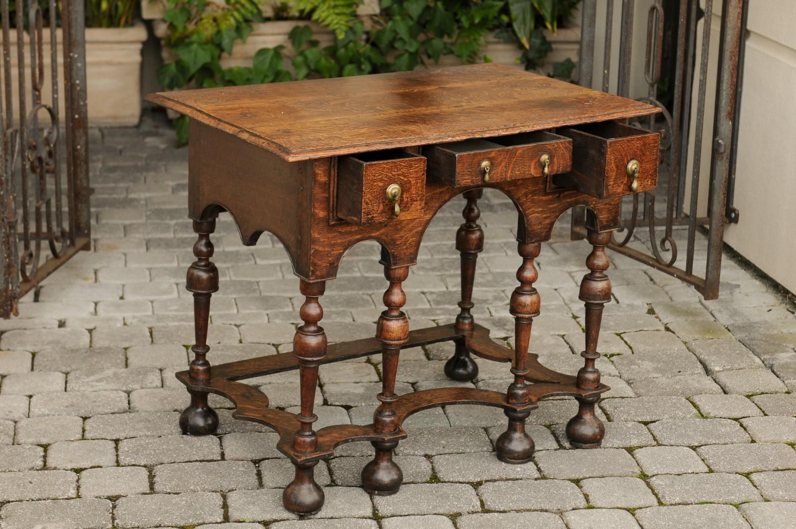 Turned William and Mary Style 1800s Oak Side Table with Trumpet Legs and Three Drawers For Sale