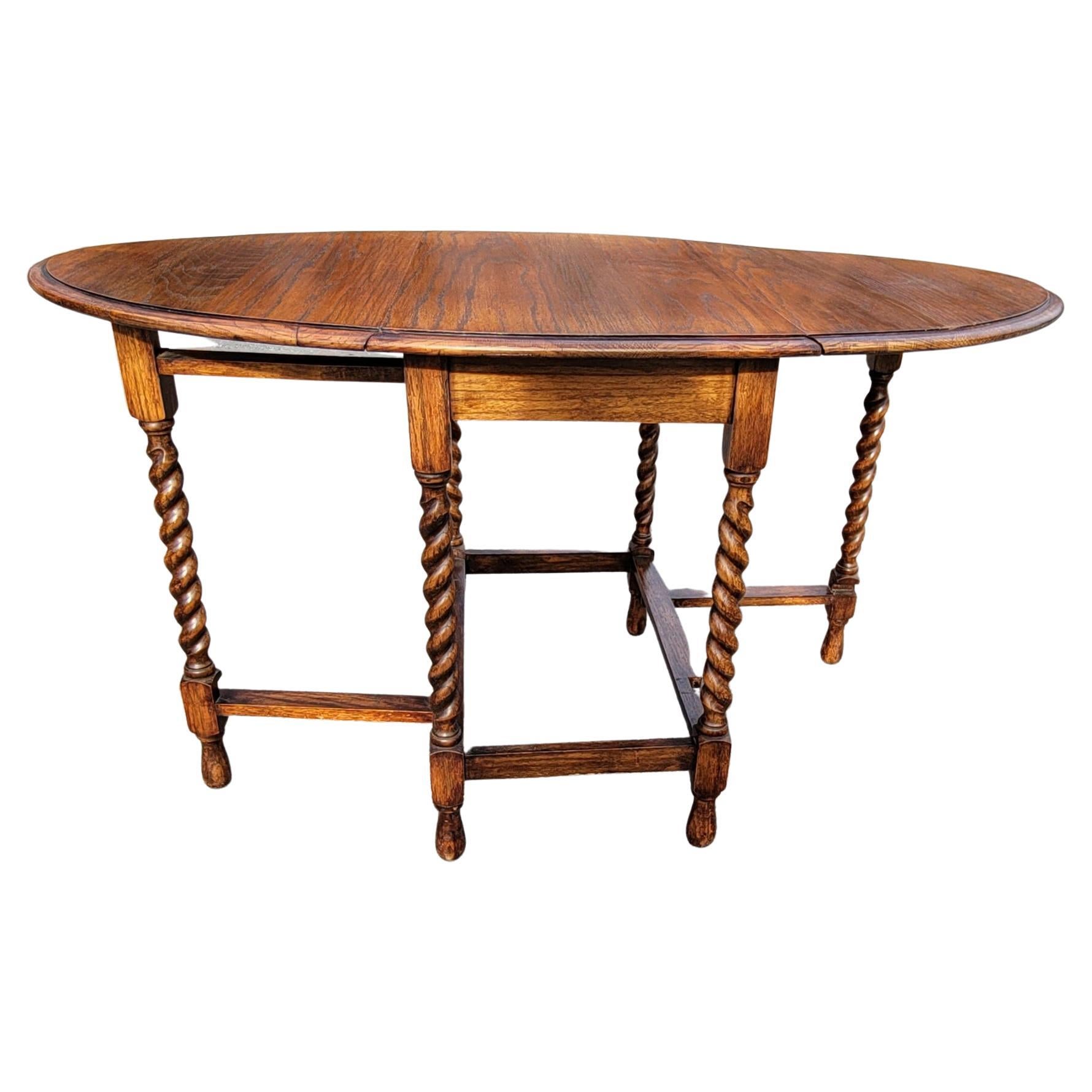 An exquisite William and Mary style barley twist oak Gateleg drop leaf Breakfast Table in 100% solid oak with great patina.
Measures 52