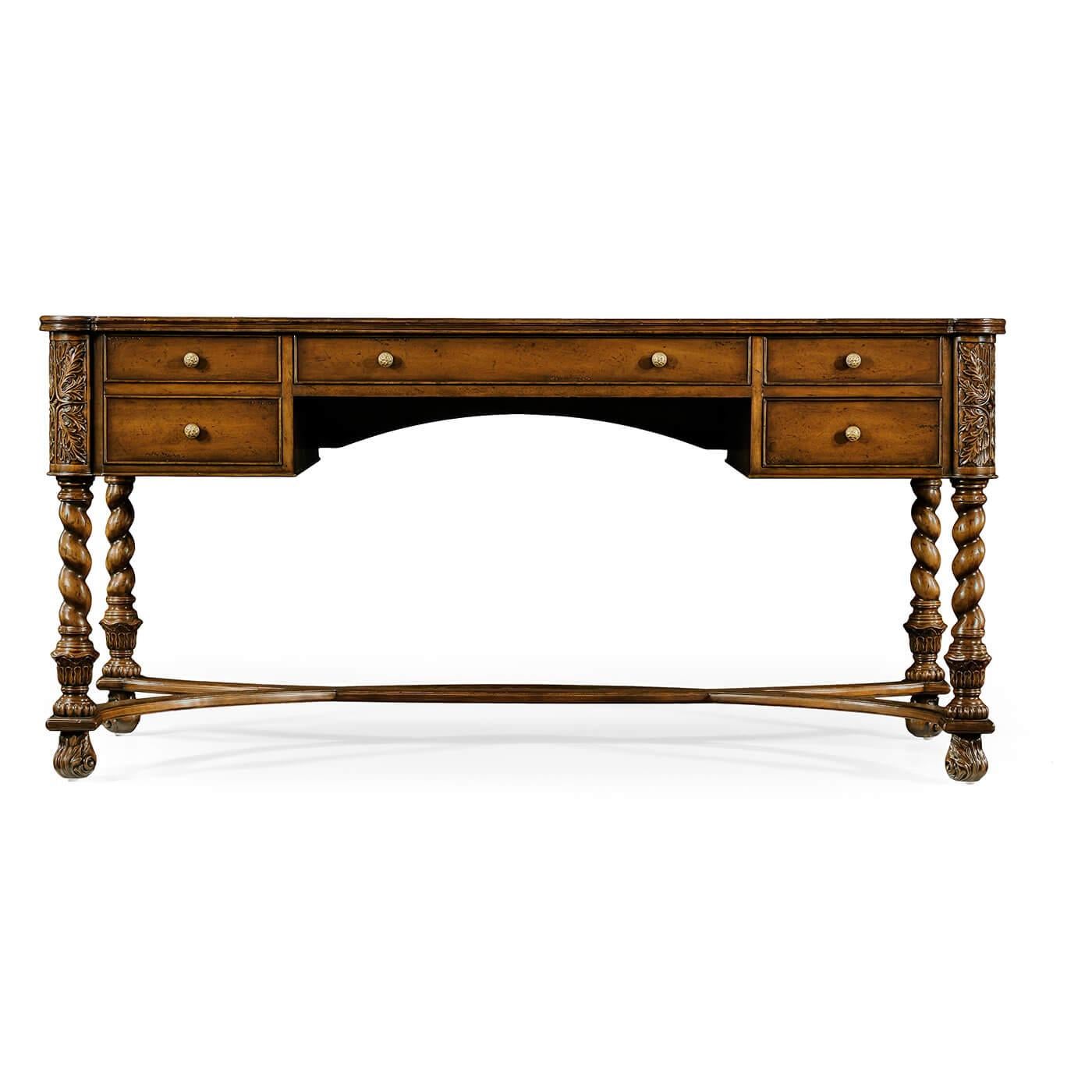 William and Mary style walnut desk, with a tan inset leather top with oyster veneer details to the edges of the writing surface set on heavily carved and barley twist legs with intersecting C-Stretchers. 

Dimensions: 63