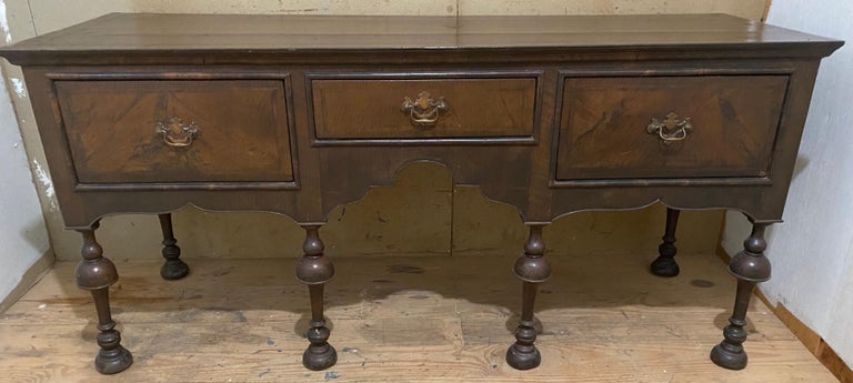 The rectangular top over three drawers, raised on turned legs will add style to any dining room or hallway. 
Buffet, sideboard, server, sofa table, hallway table.
