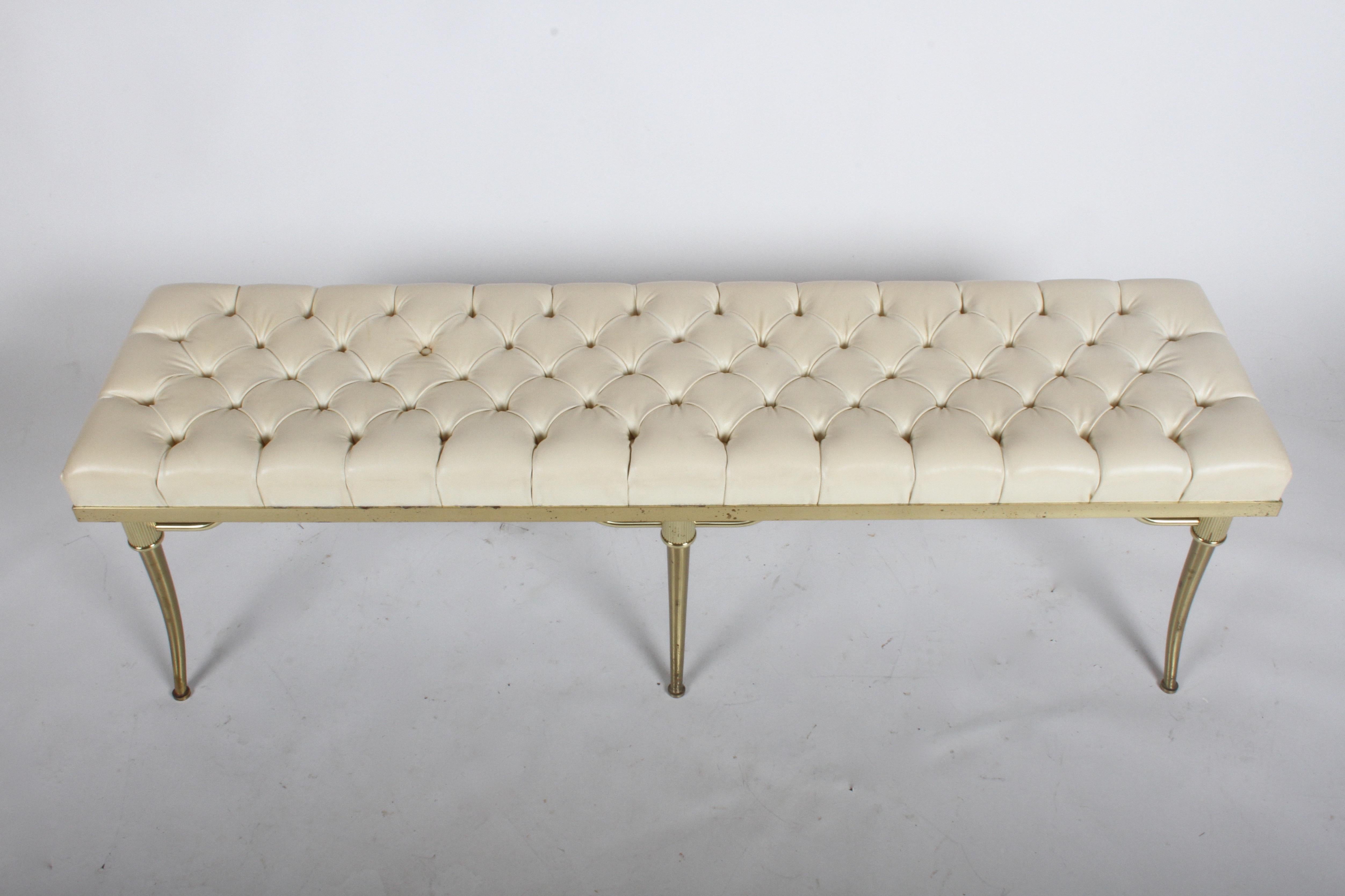 Stylish and rare midcentury bench by William Billy Haines with splayed klismos brass legs and original button tufted seat. Original upholstery should be replaced, brass show patina. Can be polished for additional cost. 

Measures: 60