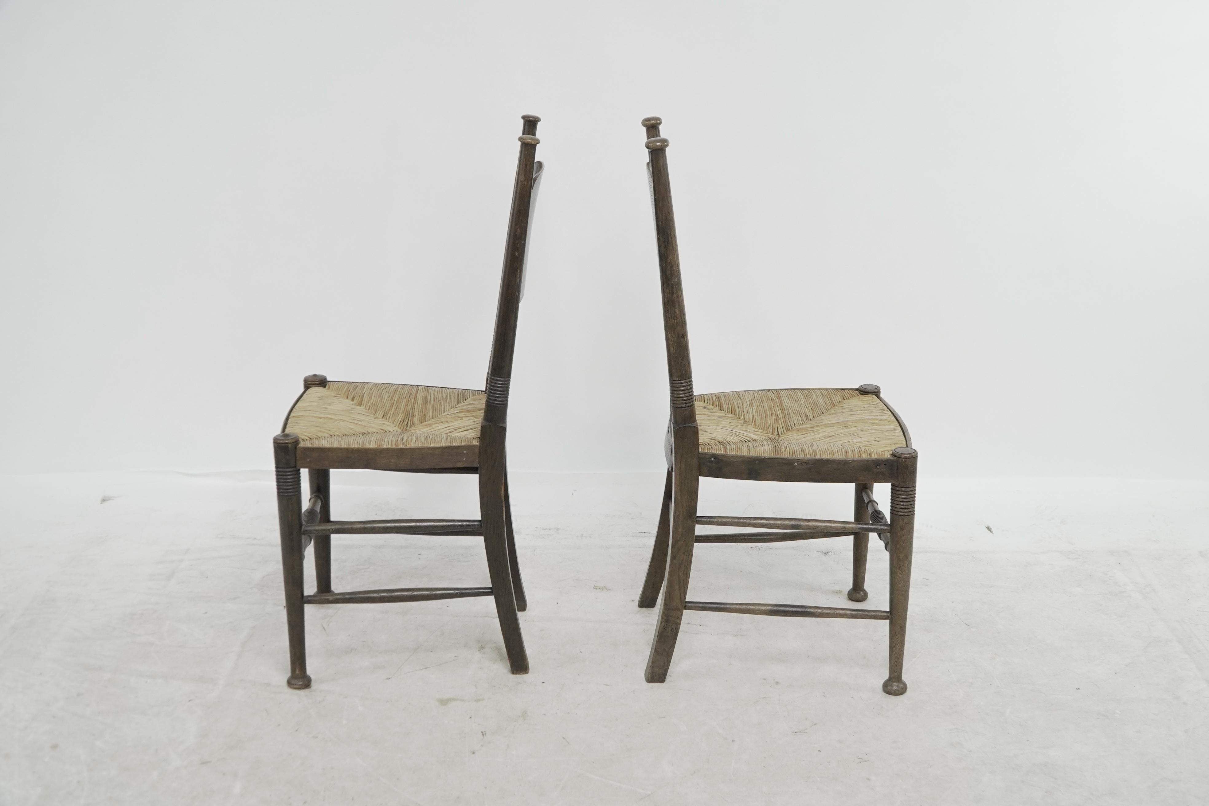 English William Birch, retailed by Liberty & Co. Pair of Arts & Crafts oak dining chairs For Sale
