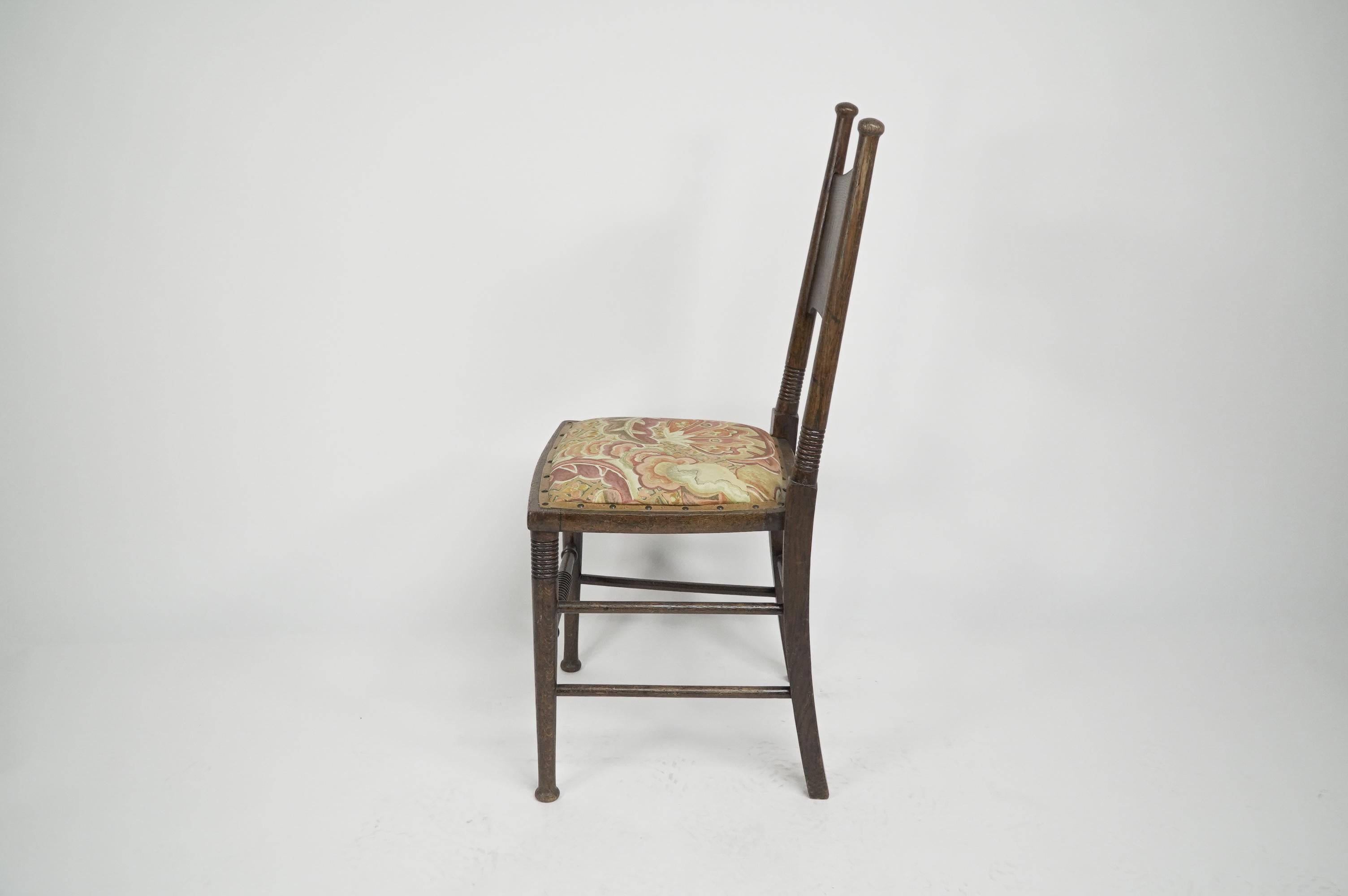 Early 20th Century William Birch. An Arts and Crafts Oak upholstered chair For Sale