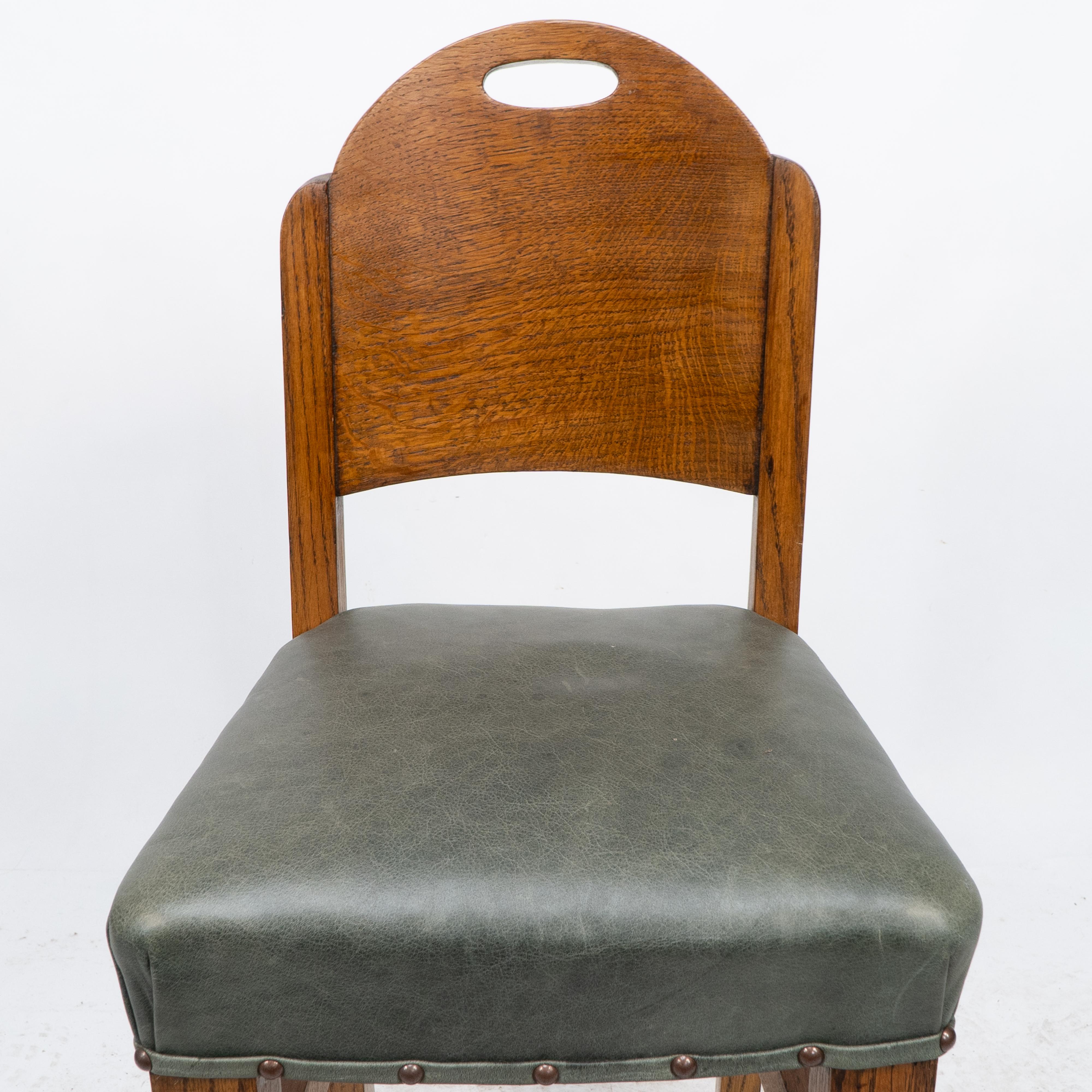 Early 20th Century William Birch. An Arts & Crafts high seat music chair with leather seat For Sale