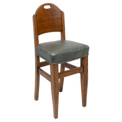 William Birch. An Arts & Crafts high seat music chair with leather seat