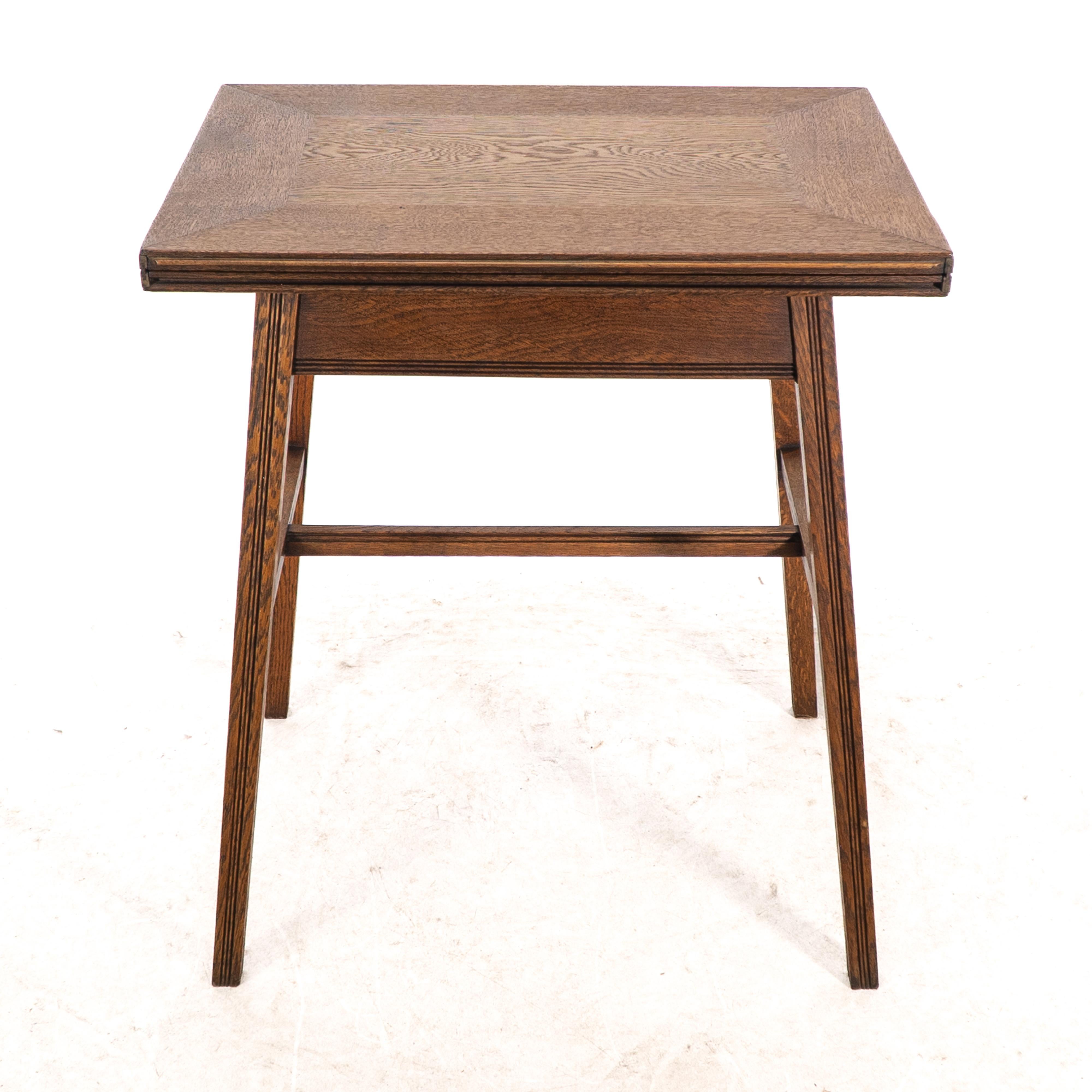 English William Birch. Arts & Crafts oak card or game table with a swivel & fold out top For Sale