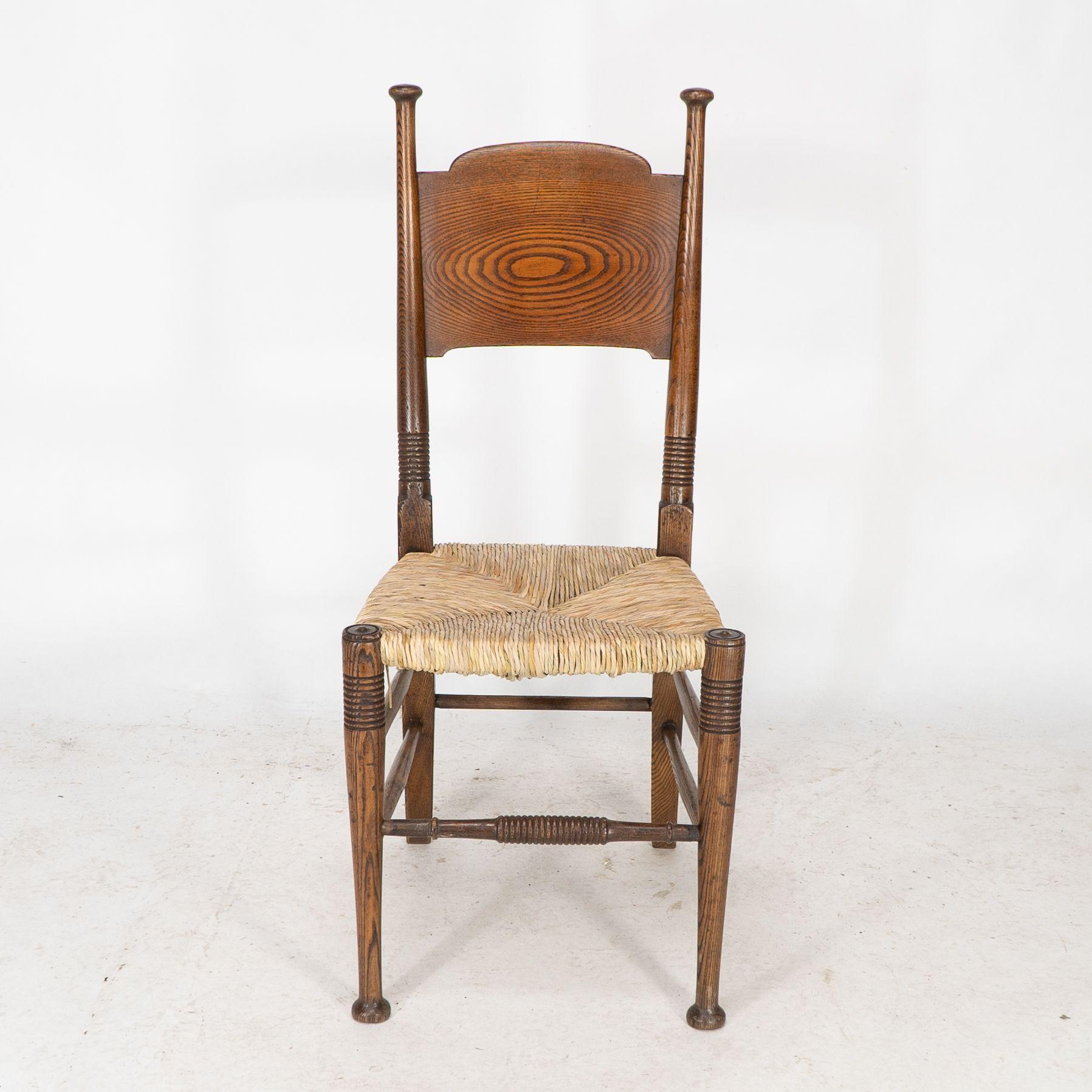 William Birch for Liberty & Co. A pair of Arts & Crafts rush seat oak chairs In Good Condition For Sale In London, GB