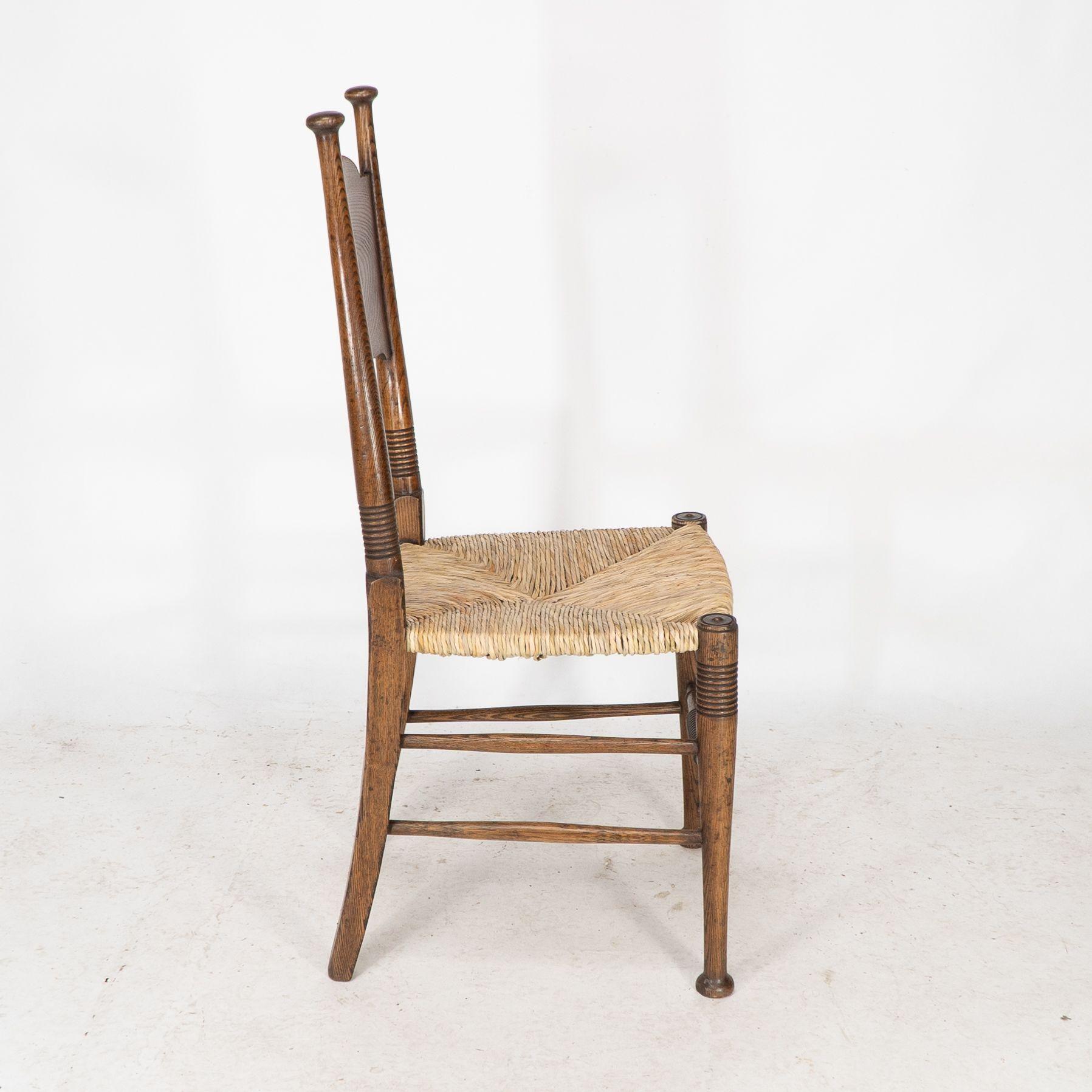 Rush William Birch for Liberty & Co. A pair of Arts & Crafts rush seat oak chairs For Sale