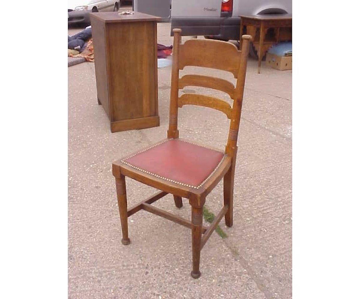 Arts and Crafts William Birch for Liberty & Co. a Set of Sixteen Arts & Crafts Oak Dining Chairs For Sale