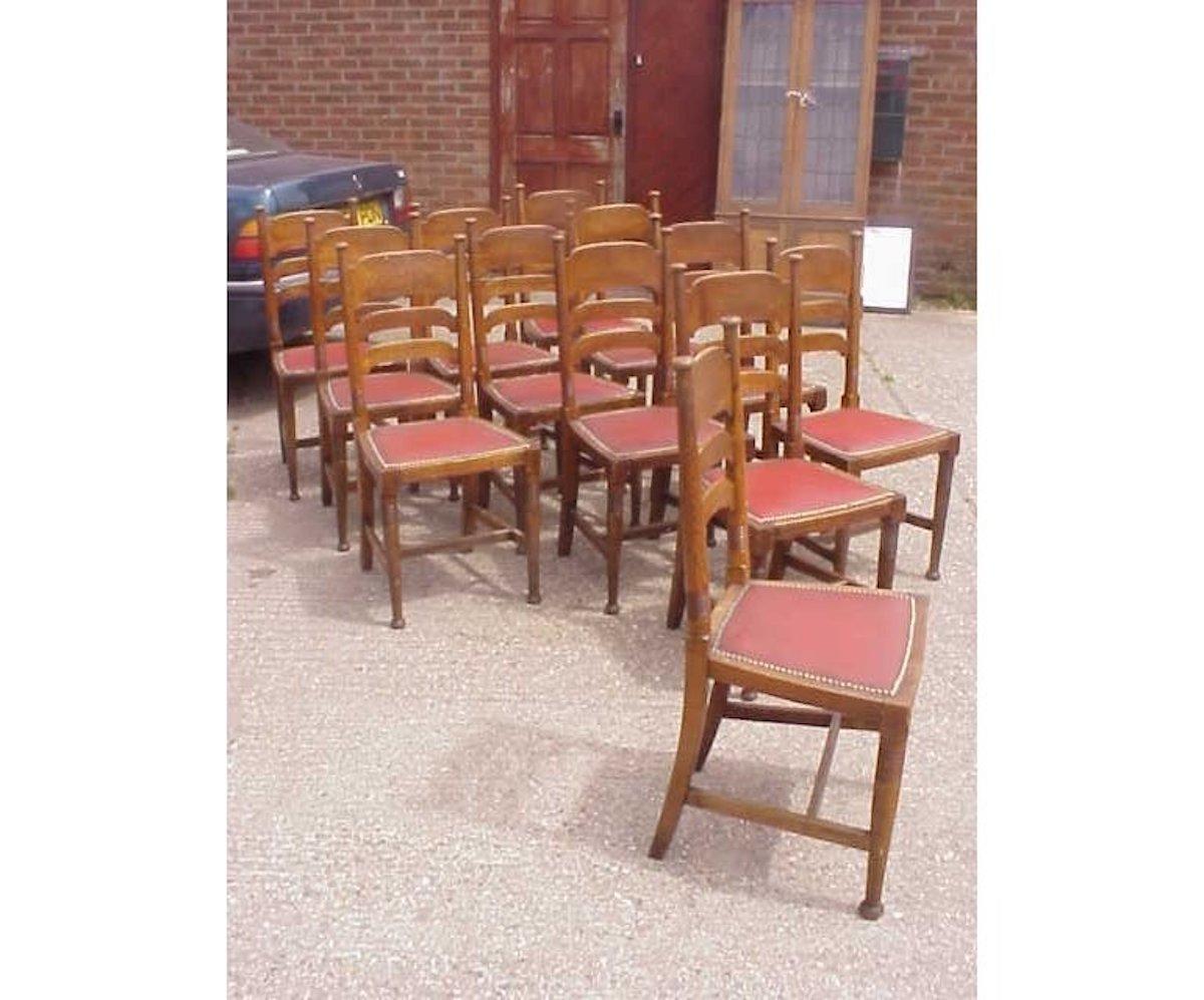 English William Birch for Liberty & Co. a Set of Sixteen Arts & Crafts Oak Dining Chairs For Sale