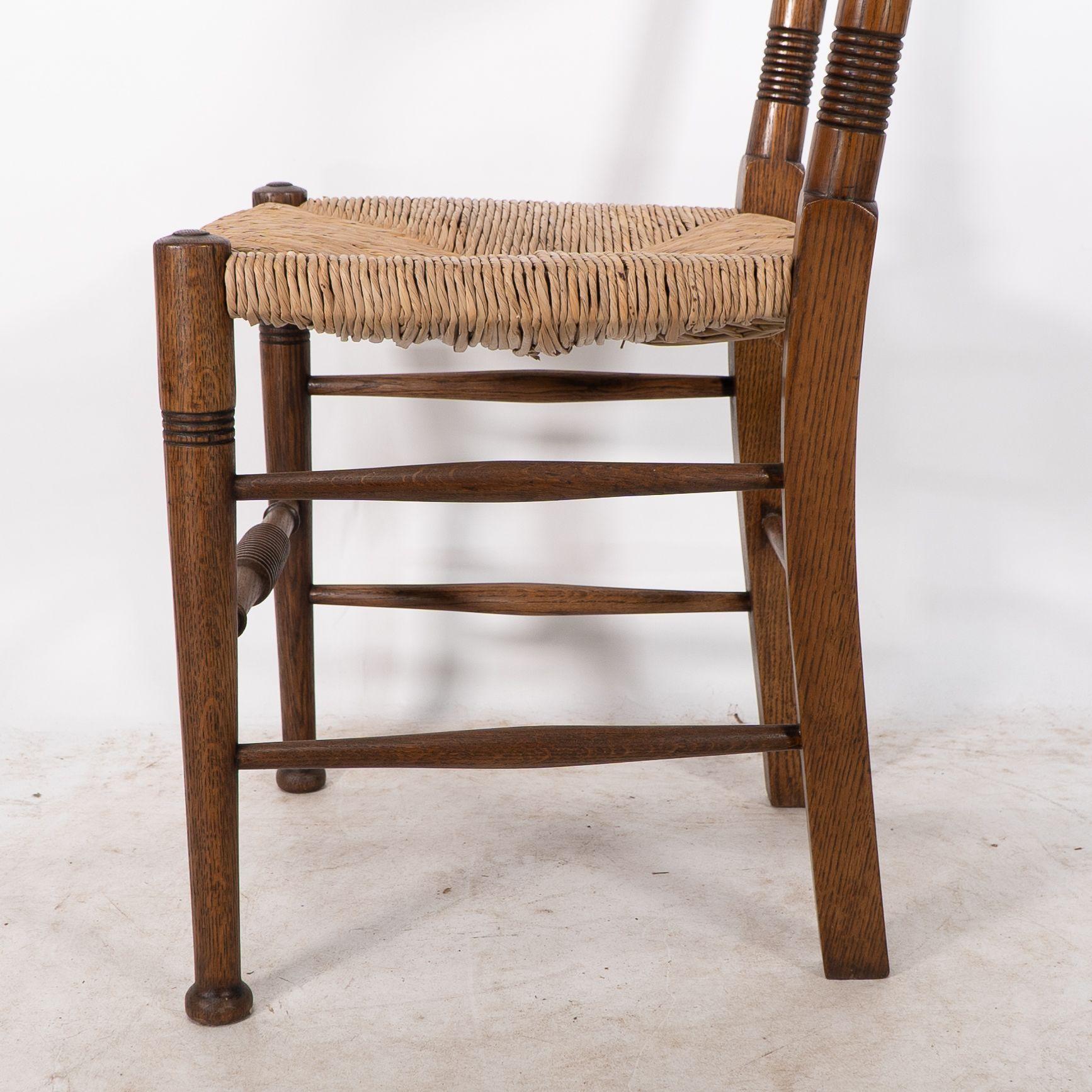 William Birch. Liberty & Co. A Arts and Crafts rush seat oak dining chair For Sale 5