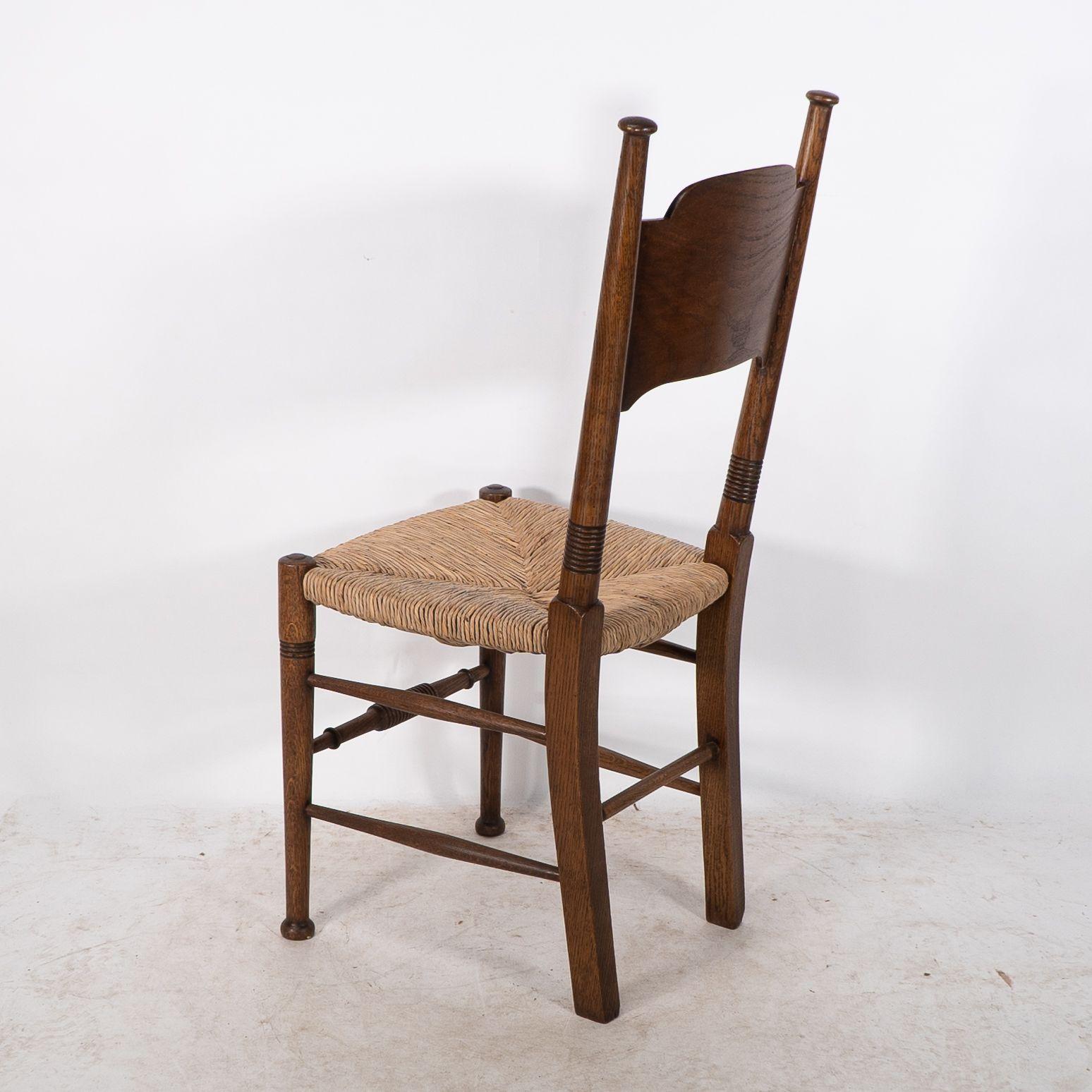 William Birch. Liberty & Co. A Arts and Crafts rush seat oak dining chair For Sale 7