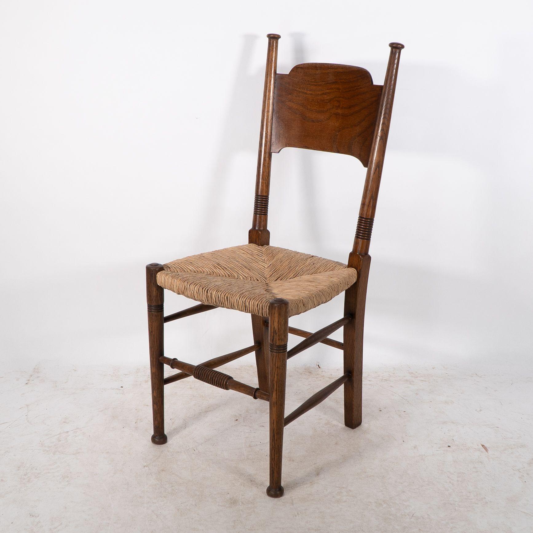 William Birch. Liberty & Co. A Arts and Crafts rush seat oak dining chair In Good Condition For Sale In London, GB