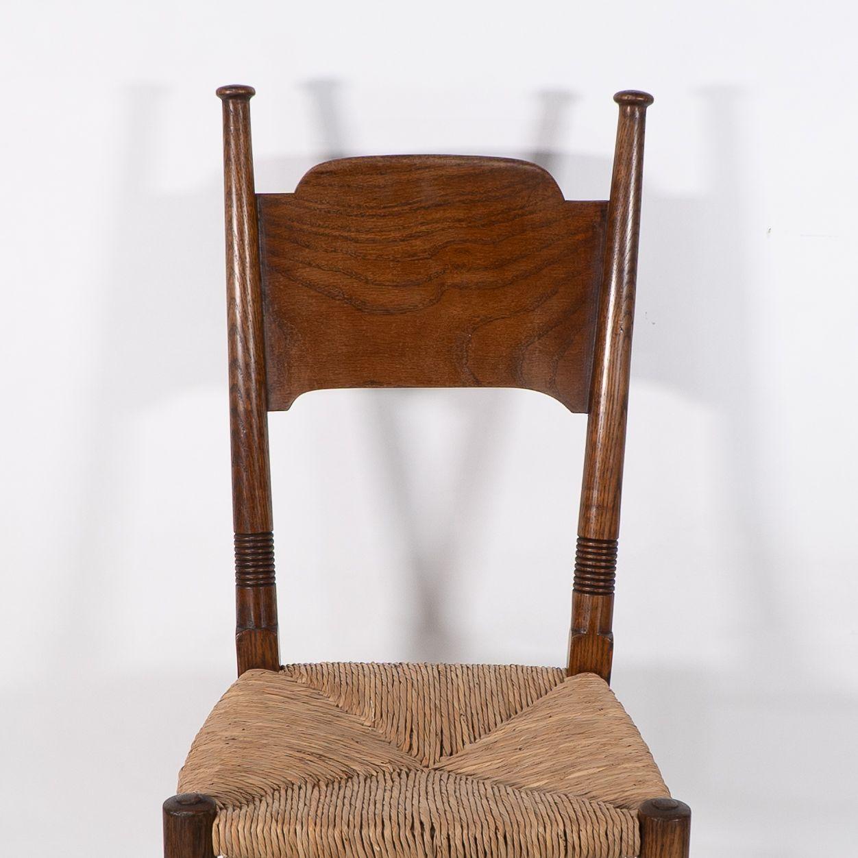 William Birch. Liberty & Co. A Arts and Crafts rush seat oak dining chair For Sale 1