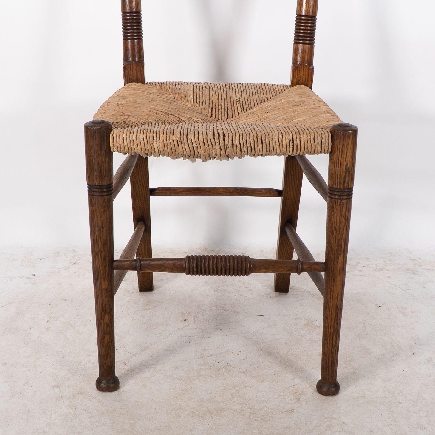 William Birch. Liberty & Co. A Arts and Crafts rush seat oak dining chair For Sale 2