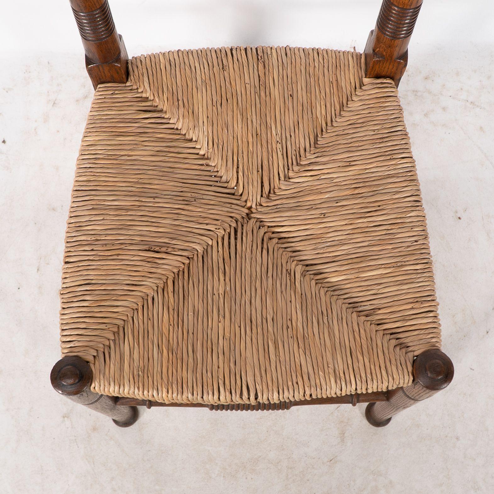 William Birch. Liberty & Co. A Arts and Crafts rush seat oak dining chair For Sale 3