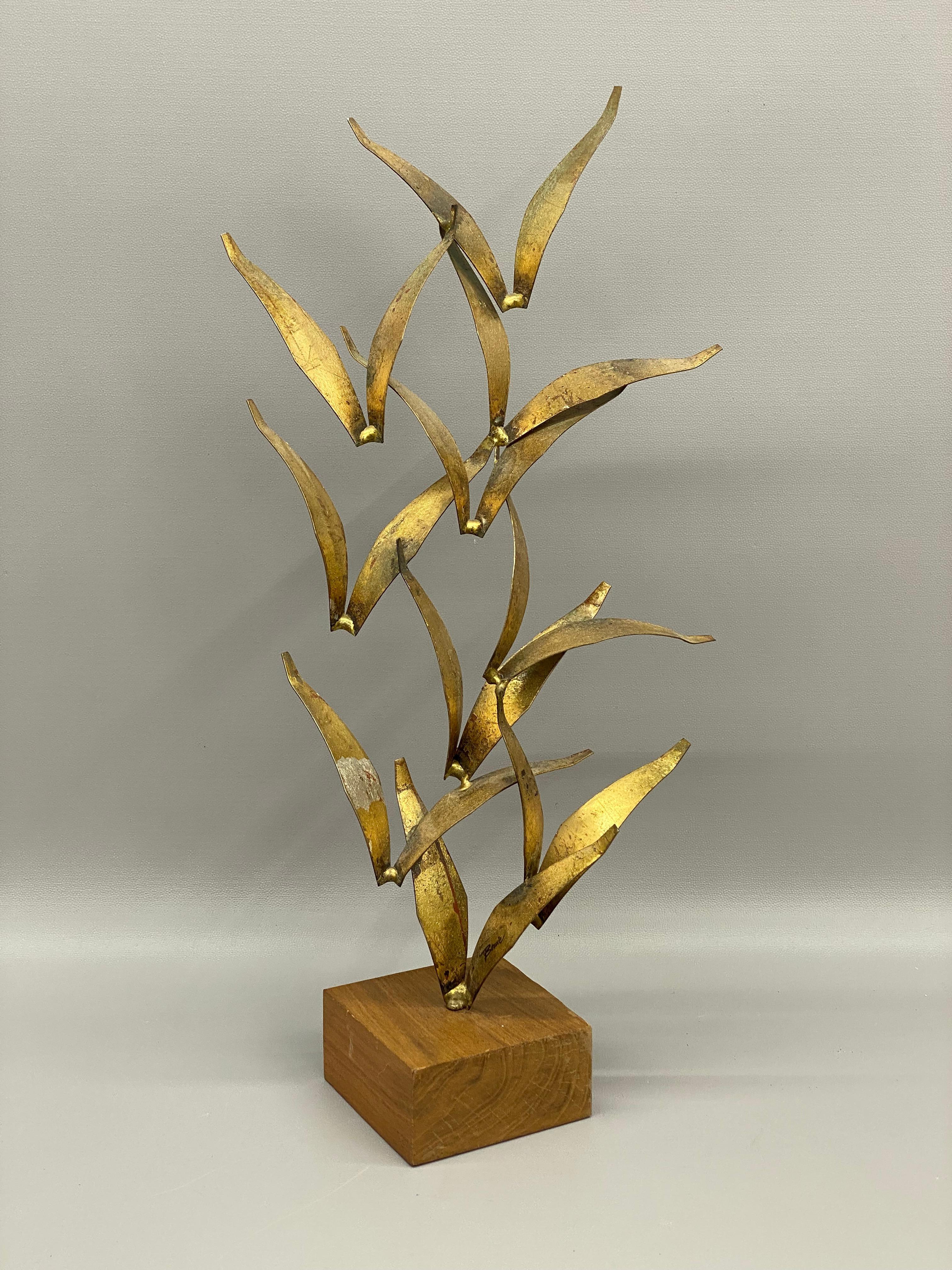 Signed William Bowie brutalist flying bird sculpture. Circa 1970. Signed, Bowie, on the lowest portion of the sculpture. Mounted on a wood block base. Each wing is gilt. 

Good overall condition with minor cosmetic wear due to age Structurally sound