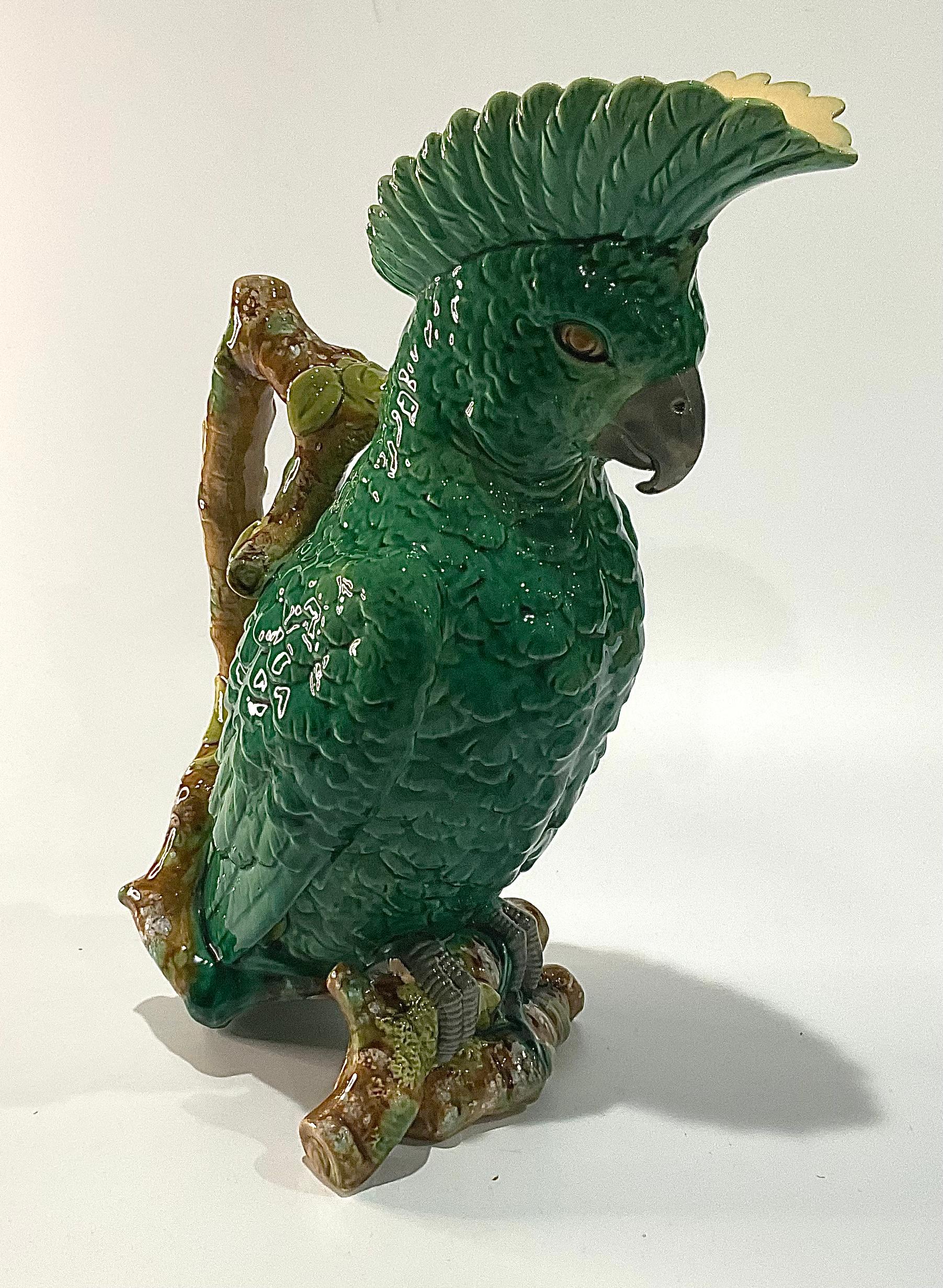 Amazing Cockatoo pitcher or jug in green by William Brownfield for Brownfield and Sons. 

William Brownfield entered the pottery trade in 1837 when he partnered with Noah Robinson and and John Wood to take over the Cobridge Pottery. In 1841 The