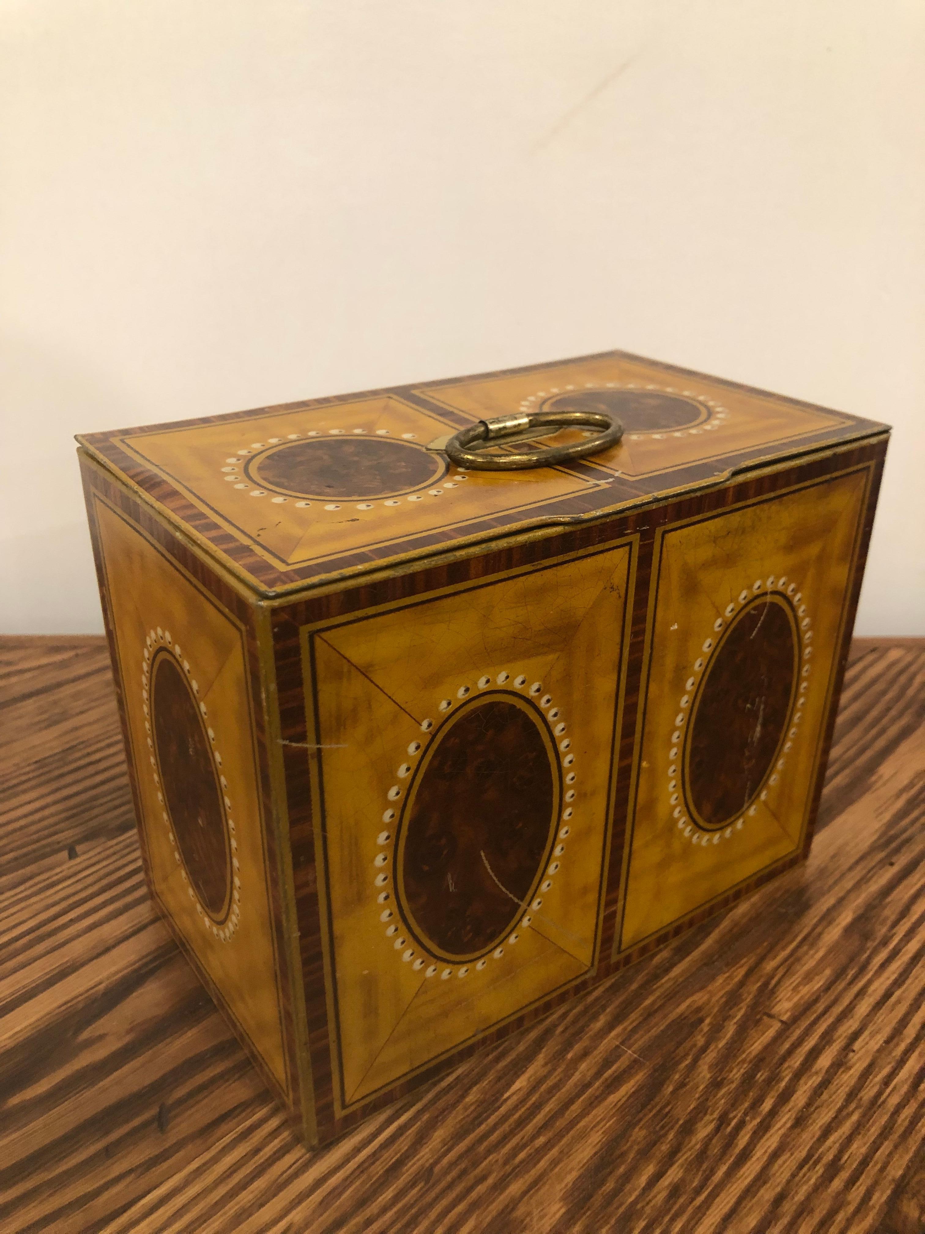English 1938 William Crawford & Sons biscuit tin which could be used as a tea caddy. Painted satinwood and mahogany finish on the biscuit tin gives it a nice look. This is from a private collector who traveled the world buying beautiful pieces. Even