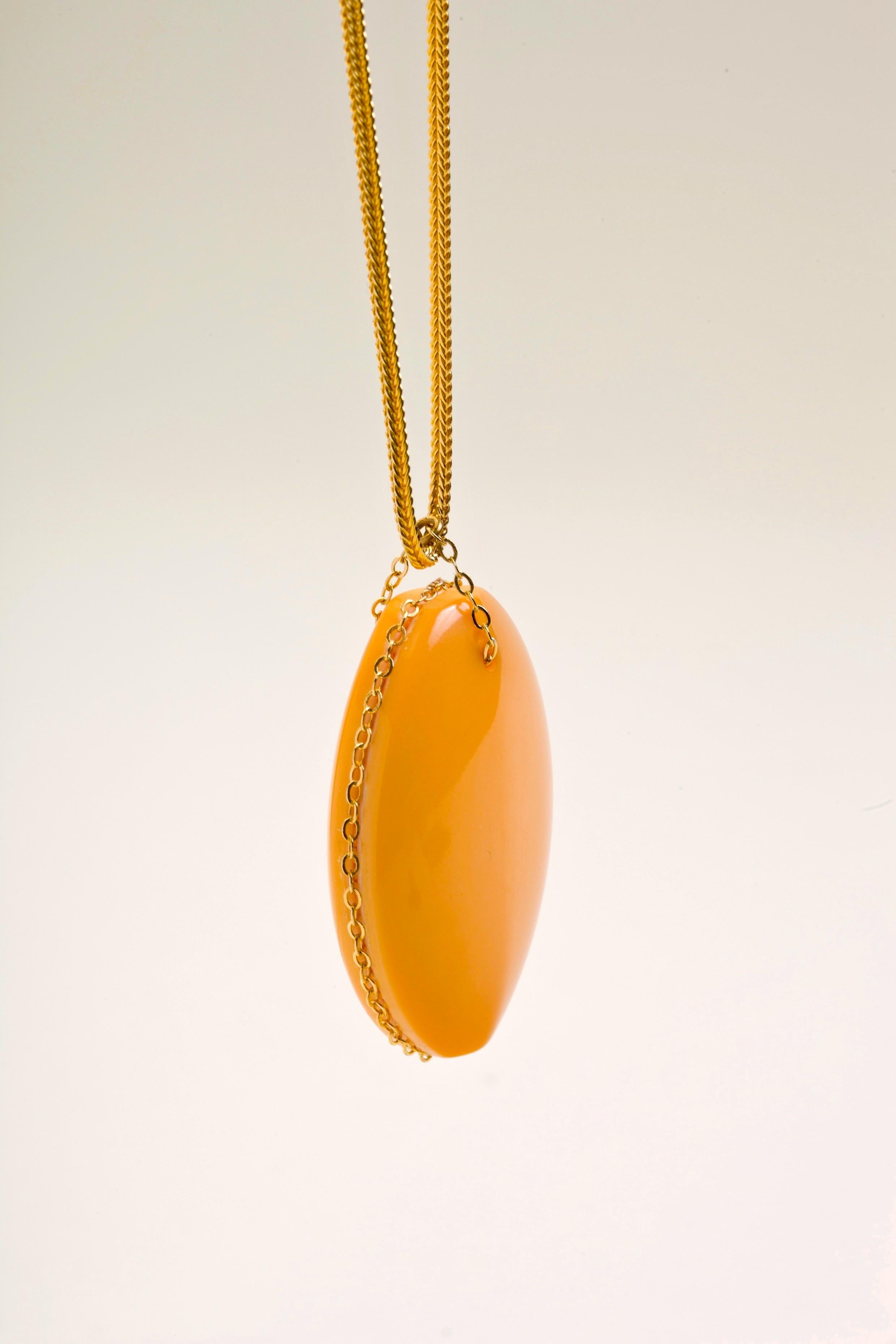 Fun Retro William De Lillo Gold Butterscotch Bakelite Pendant on a gilt metal snake chain.  Great scale and a fun piece to wear!  Signed deLillo.  Pendant is 2.25