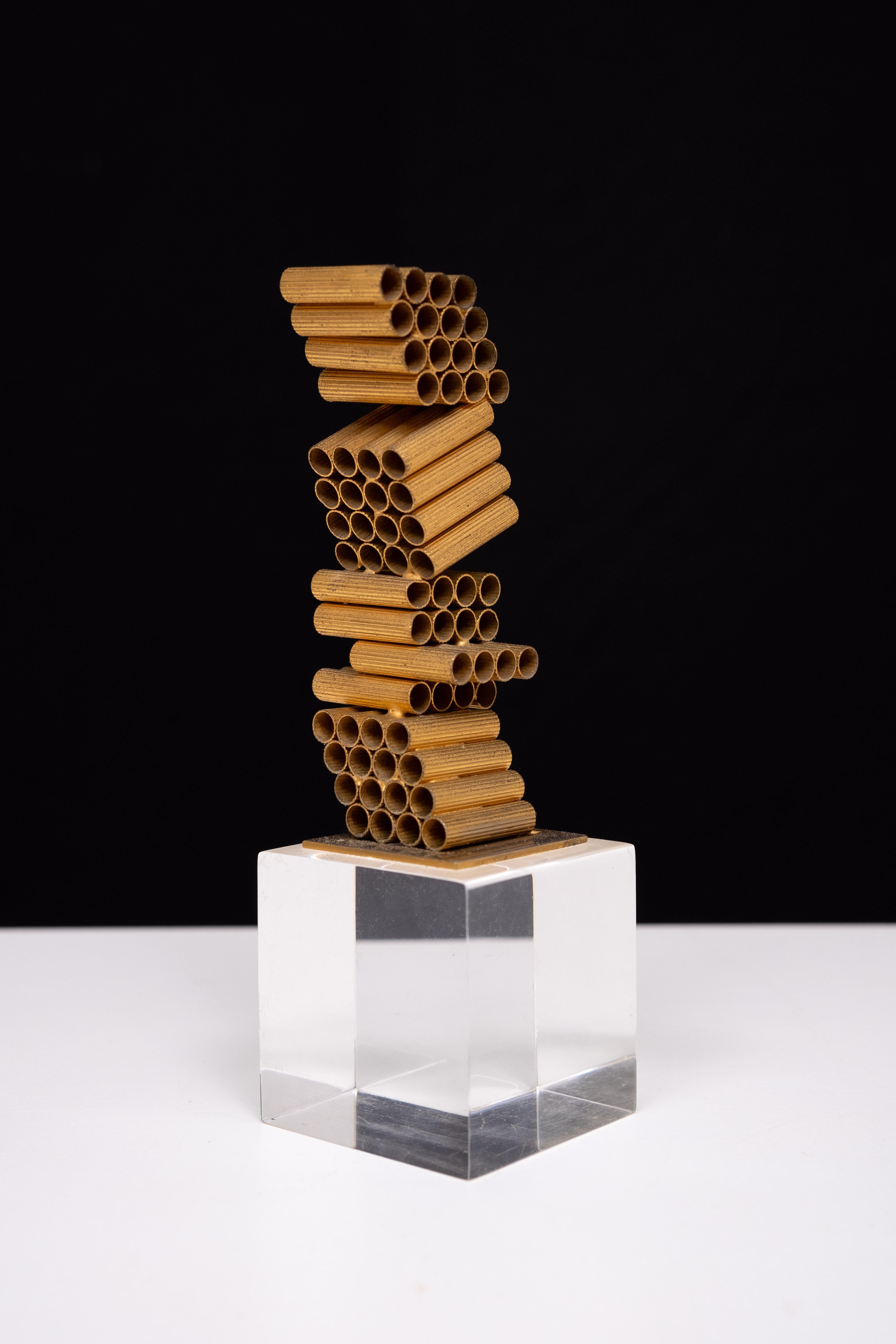 William de Lillo .  Jeweler and sculptor . Unique Gilded Metal Modernistic sculpture .On a Lucite base . Signed . 