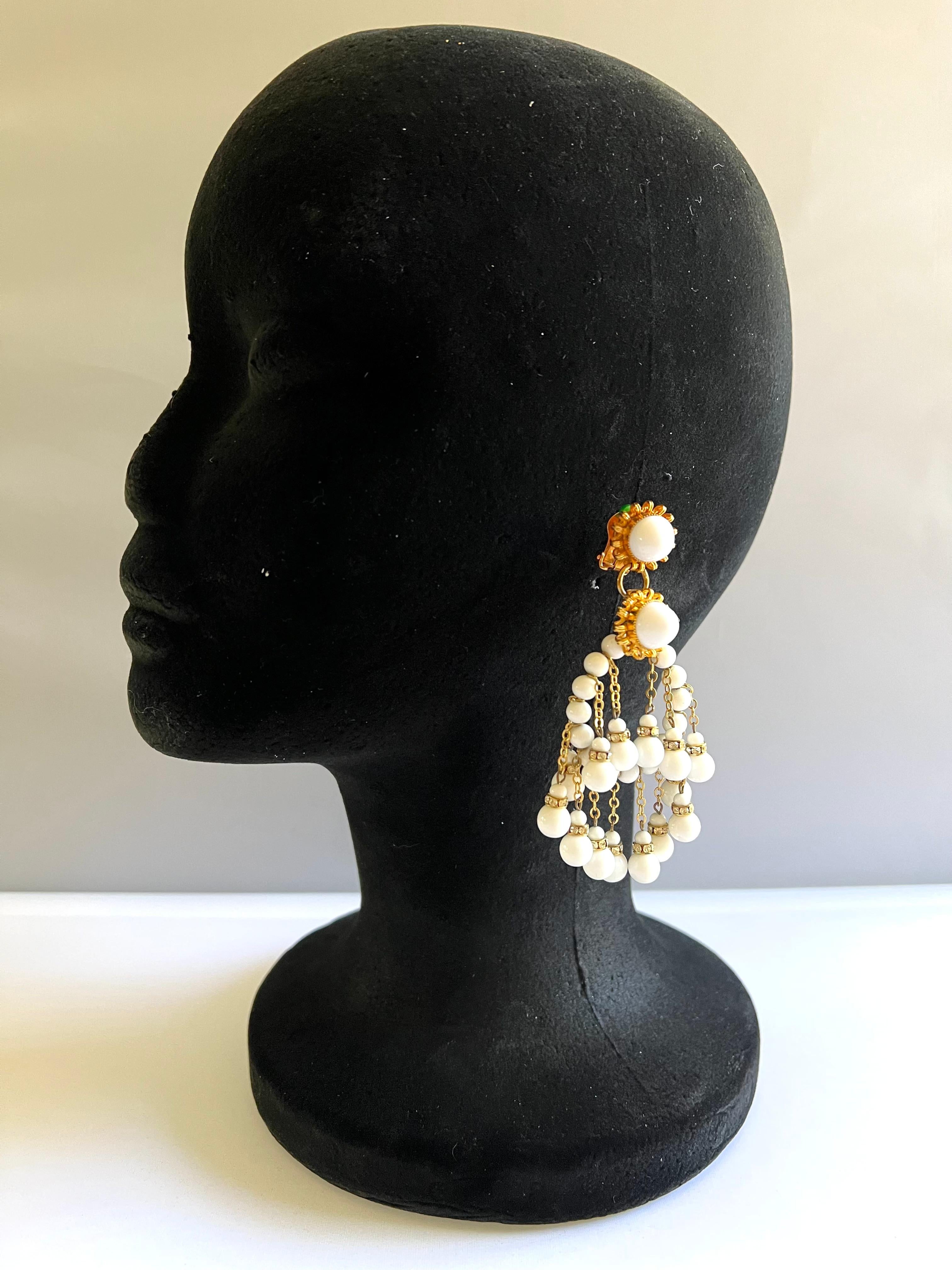 Vintage white glass bead and rhinestone hoop and fringe clip-on earrings by William de Lillo.