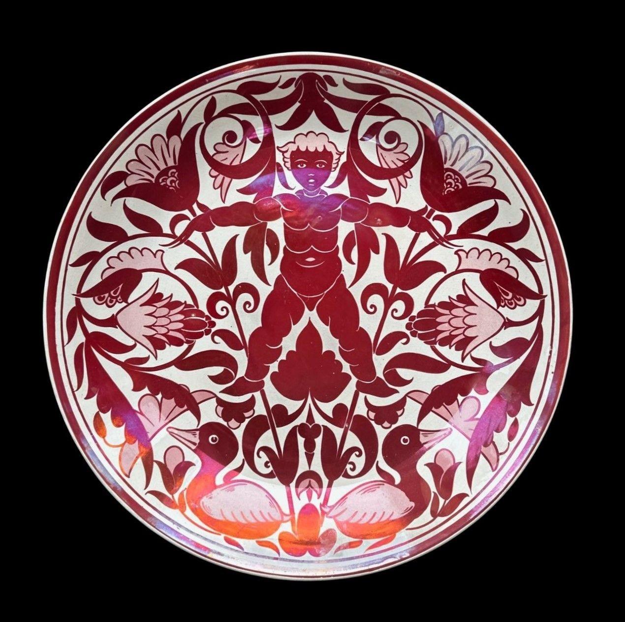 5446
William De Morgan Charger with a Good Ruby Lustre Firing.
Decorated with a Naked Boy, Ducks and Flowers by Fred Passenger
Several light and fine scratches to the surface
35.5cm wide
Circa 1890
Design featured in “The Designs of William De