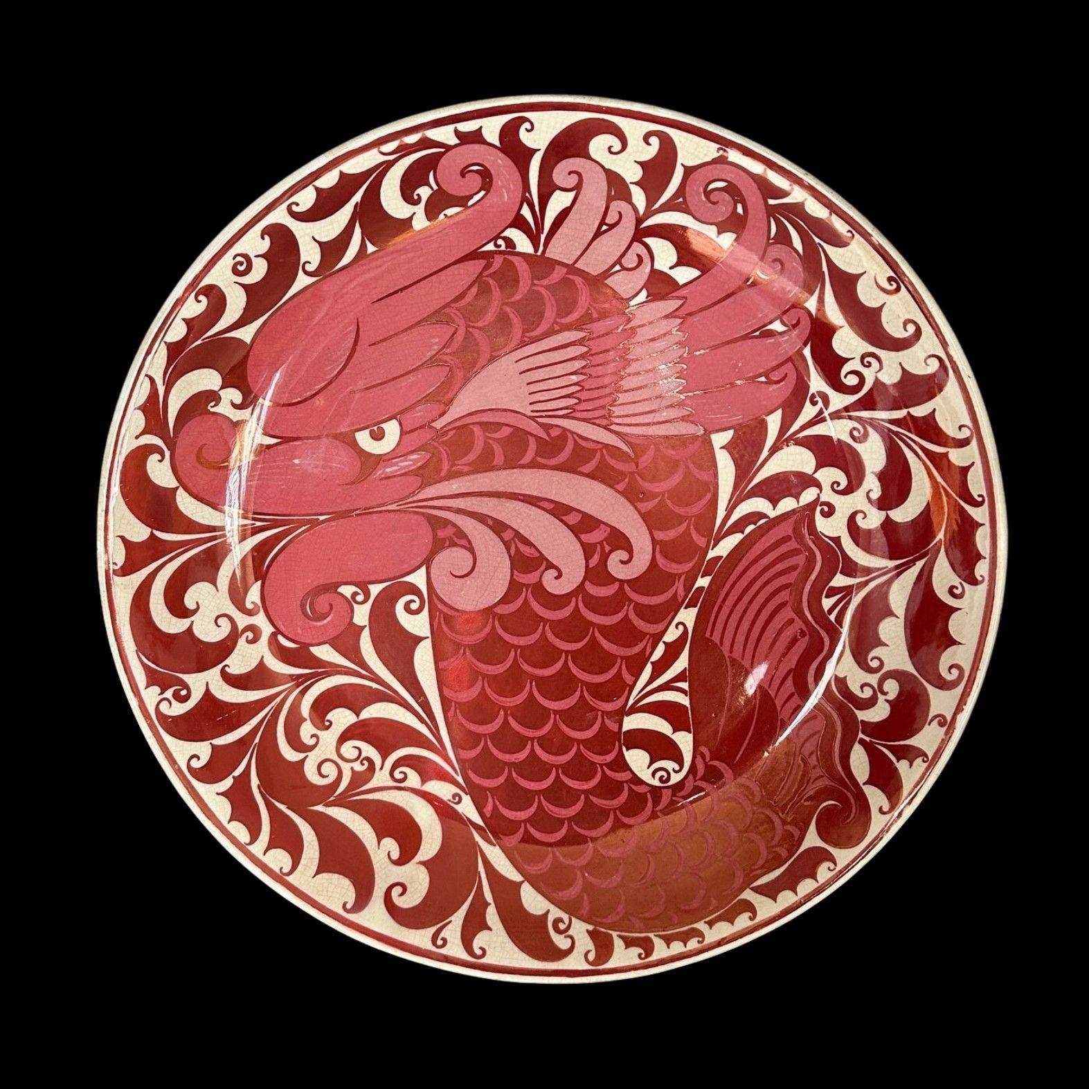 5412
Ruby Lustre Charger by William De Morgan decorated with a Single Dolphin
With a good, strong lustre, there is professional restoration to a crack to the rim
36.5cm wide, 5.5cm deep
Circa 1885
