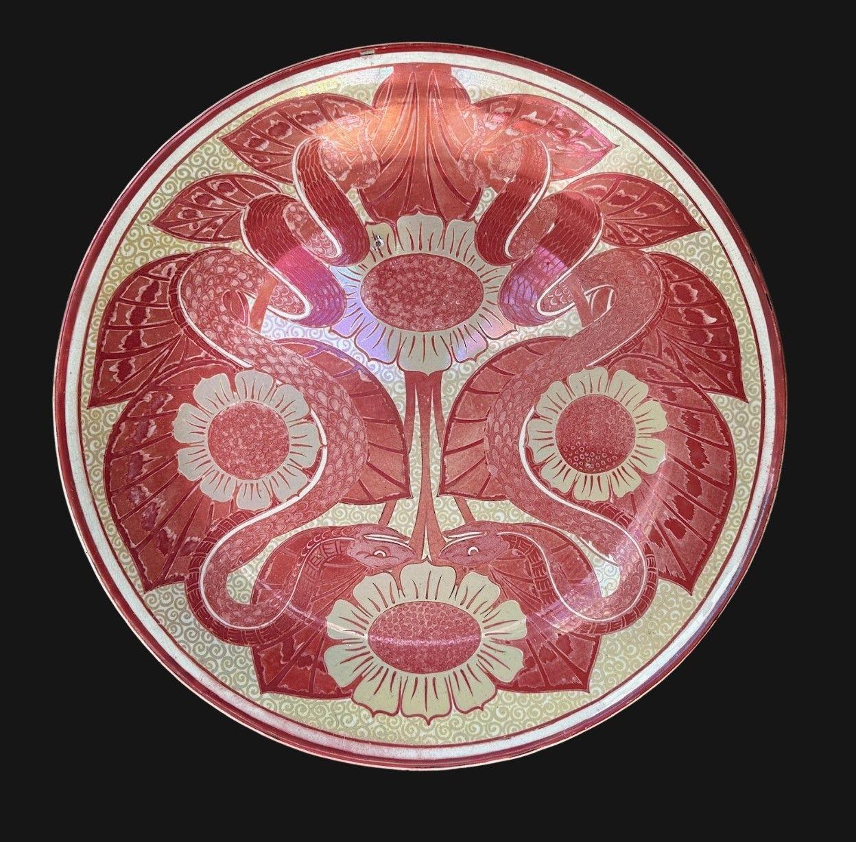 5506
William De Morgan Double Lustre Charger decorated with Mirror-Image Serpents between Sunflowers and Foliage
36cm wide, 5cm high
Circa 1890
Post code in “invisible ink” to rear