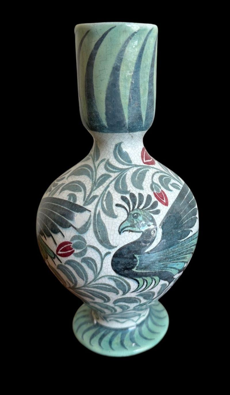 5390
William De Morgan Polychrome Vase decorated with crested birds against a background of scrolling foliage and flowers by Edward Porter
Good restoration to the neck
20cm high
circa 1888.