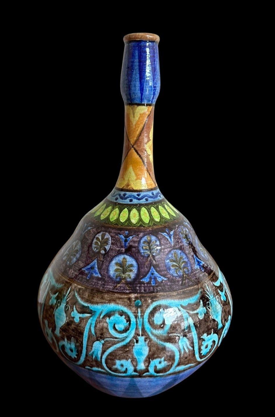 5380
Unusual William De Morgan Globe and Shaft Vase with a scarce Colourway decorated with Persian Motifs
Invisible restoration to the neck
31cm high, 18cm wide
Tulip mark for 1888 - 87.