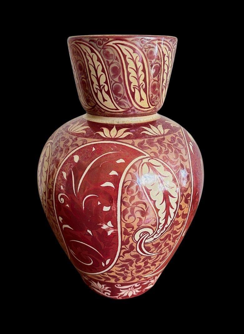 5414
Large Vase by William De Morgan in a Double Lustre Glaze with decoration of Stylised Leaves
36cm high, 23cm wide
Firing crack to the base and firing blemish to the side, crazing.