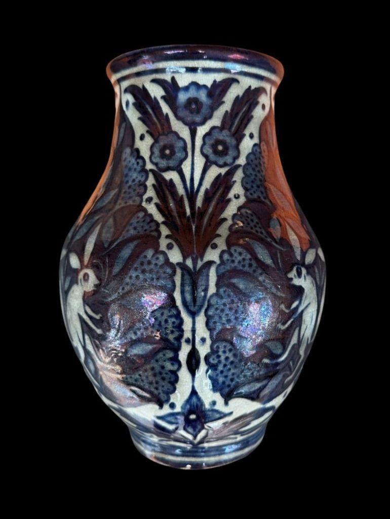 Unusual William De Morgan Lustre Vase decorated with a Symmetrical Design featuring Rabbits against a background of Palmettes and Floral Sprigs by Fred Passenger
Minute glaze frit to the rim
21.5cm high, 12.5cm wide
Circa 1890