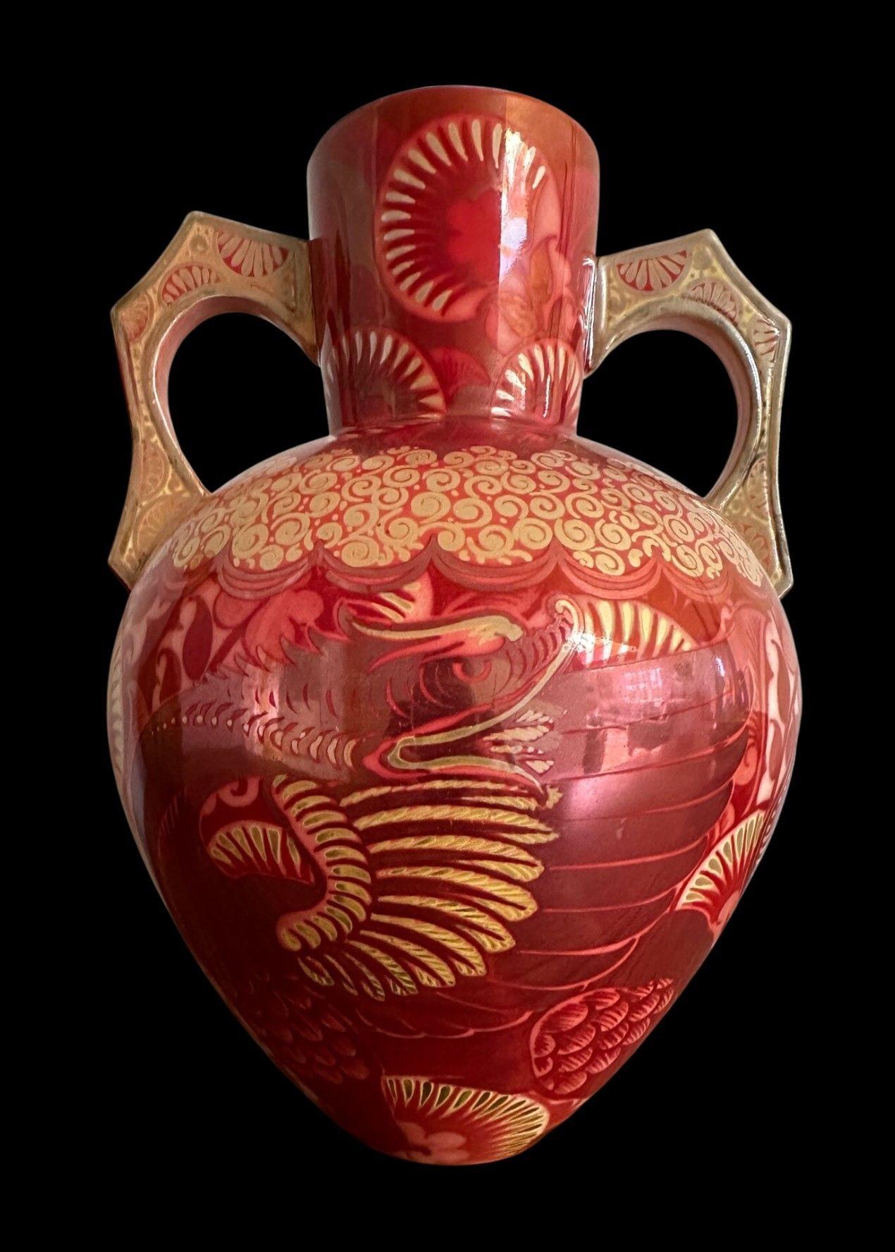 5441
William De Morgan Double Lustre Vase with Two Angular Handles decorated with Two Winged Dragons with A Background of Palmettes
Restoration to Handle and Neck
Circa 1880s
30cm high, 21cm wide