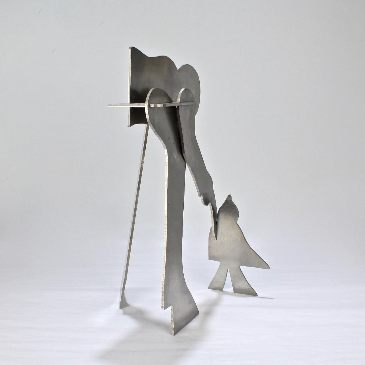 Mid-Century Modern Sculpture de puzzle moderniste en aluminium de William Dickey King représentant un homme avec un oiseau en vente